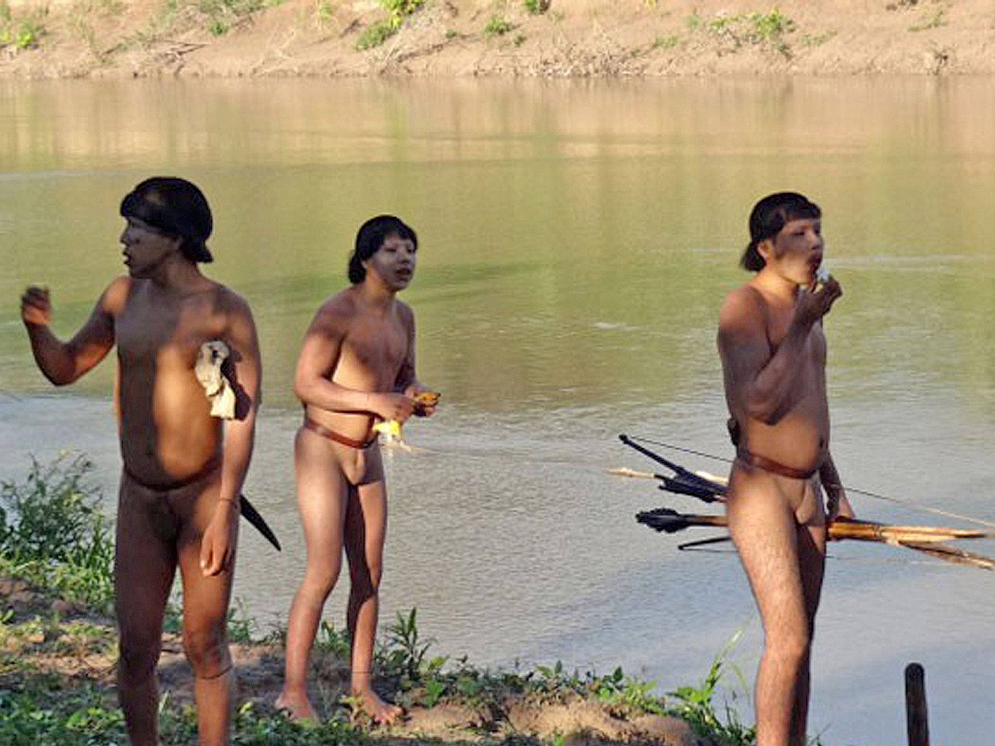 Isolated Amazonian indians on the banks of Envira River in Brazil