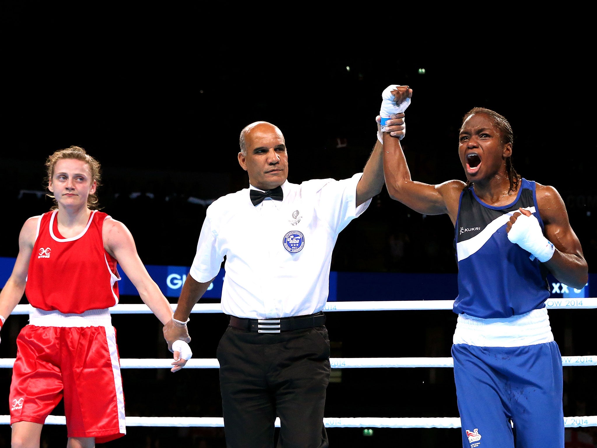 Nicola Adams celebrates winning gold after beating Michaela Walsh of Northern Ireland