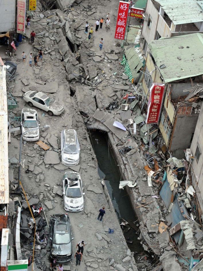 Locals survey the damage from massive gas explosions in Kaohsiung, Taiwan