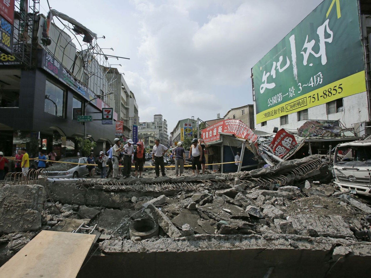 Locals survey the damage from massive gas explosions in Kaohsiung, Taiwan