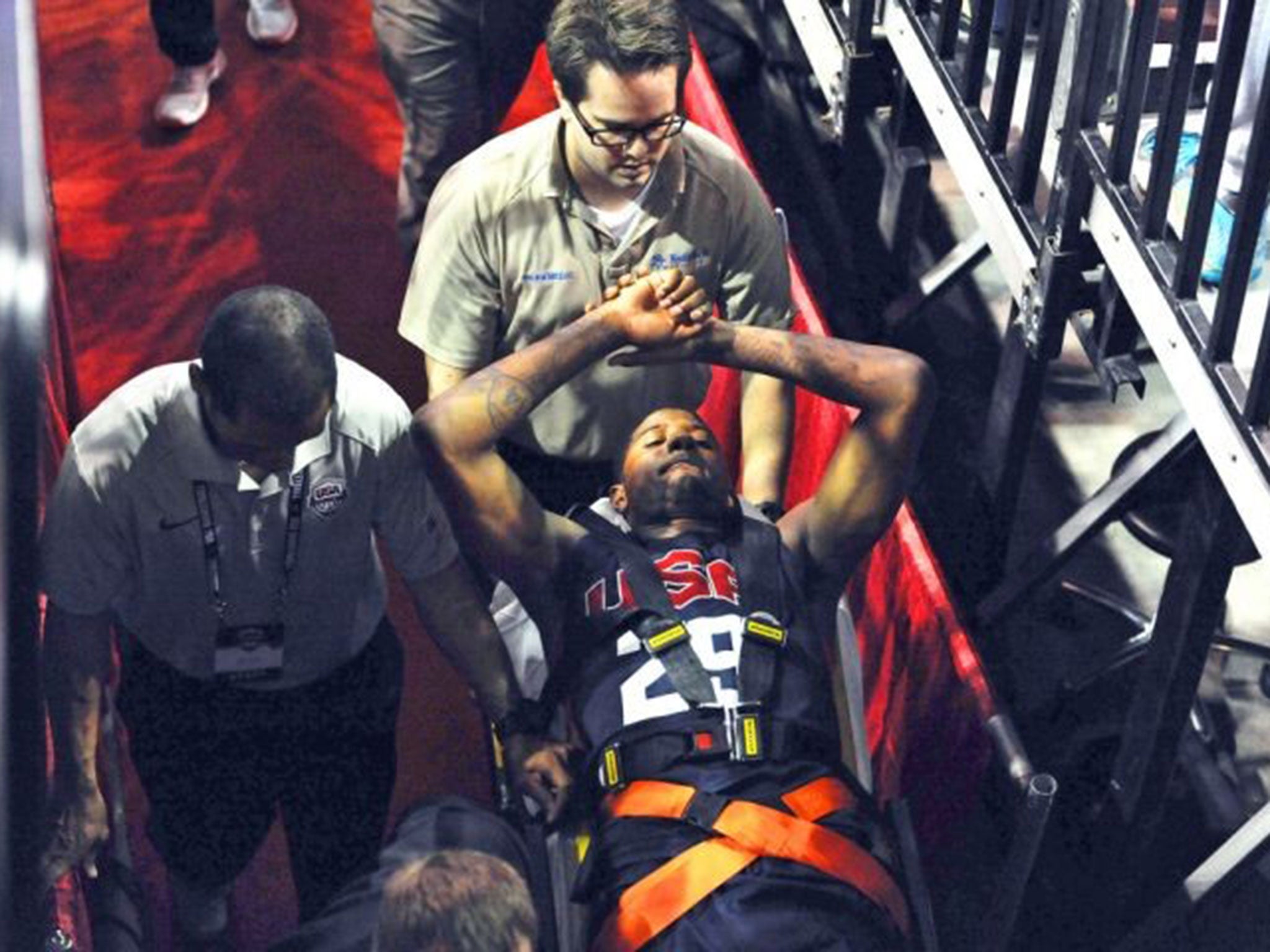 Paul George is carried off the court after suffering a broken leg