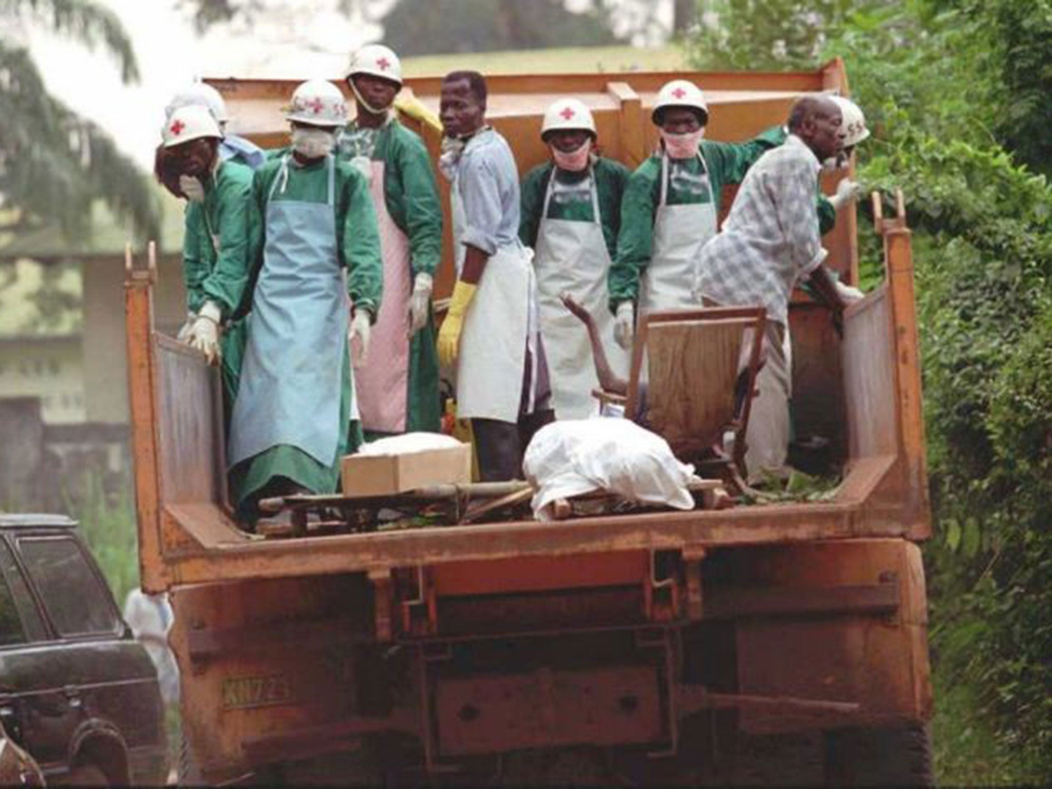 Health workers in Zaire, where ebola is feared to have spread, check bodies for signs