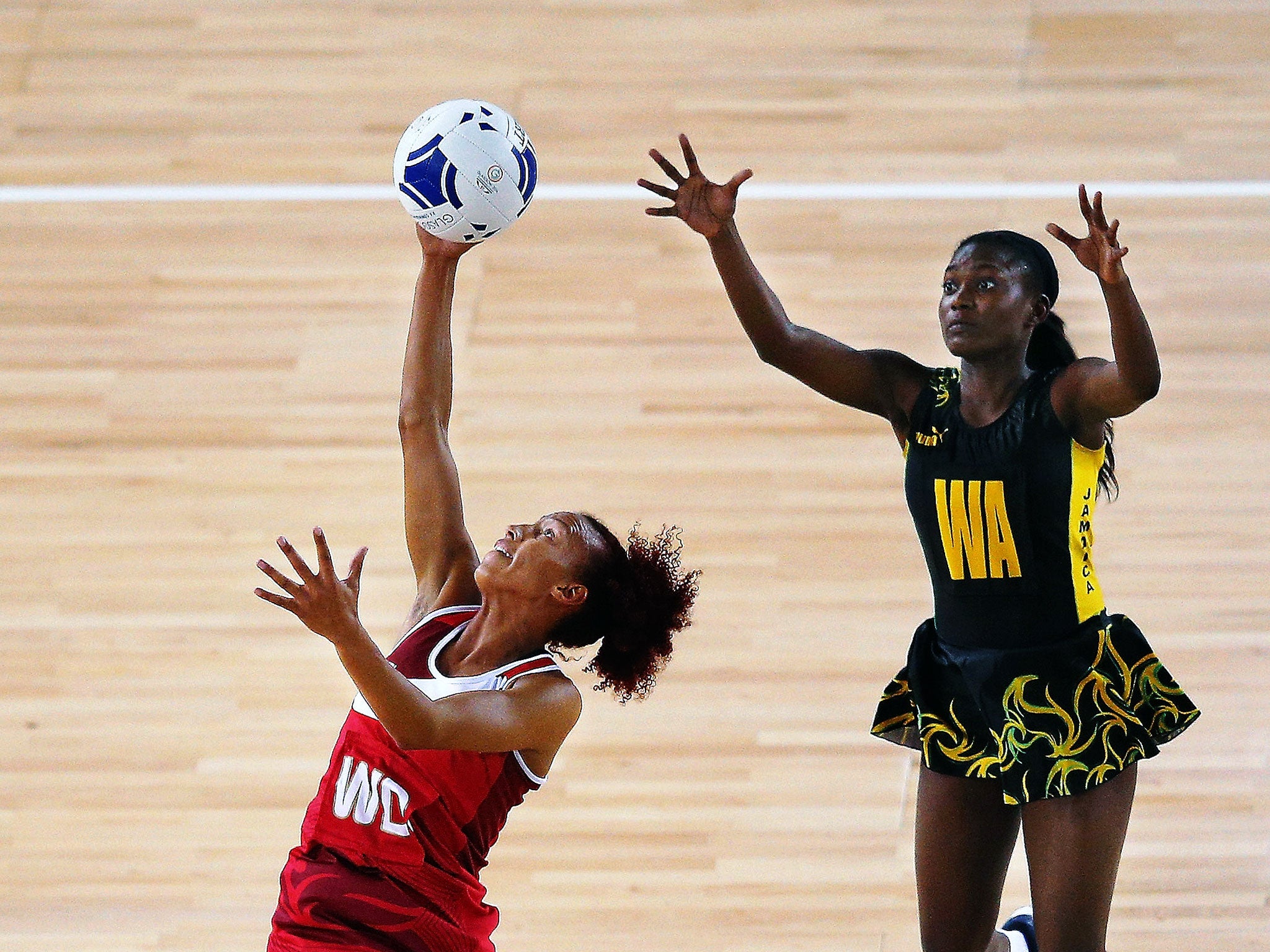 England’s Serena Guthrie (above left) and Jamaica’s Khadijah Williams compete for the ball in the bronze medal match