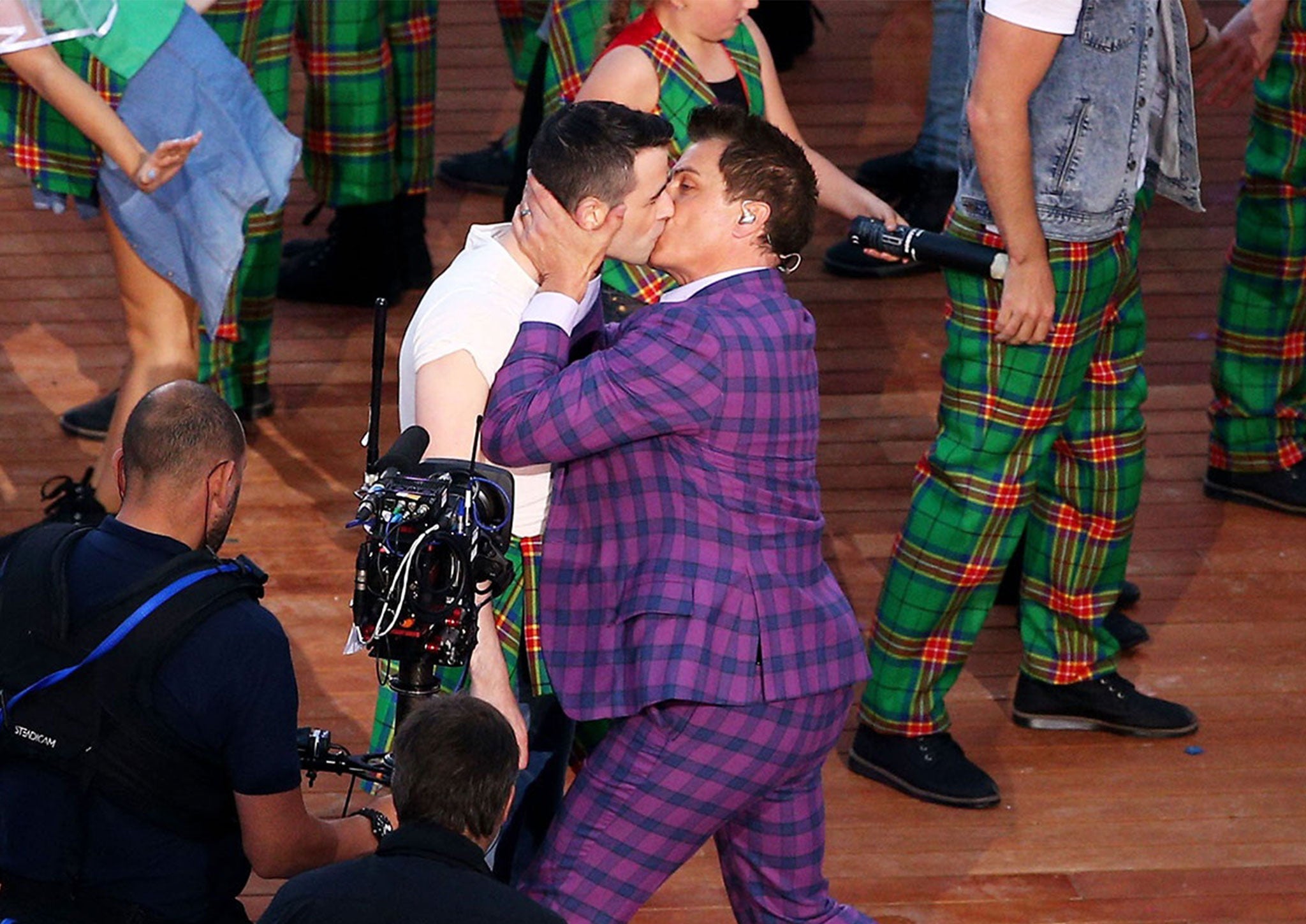 John Barrowman kisses his male “bride” at a mock Gretna Green during the Commonwealth Games opening ceremony