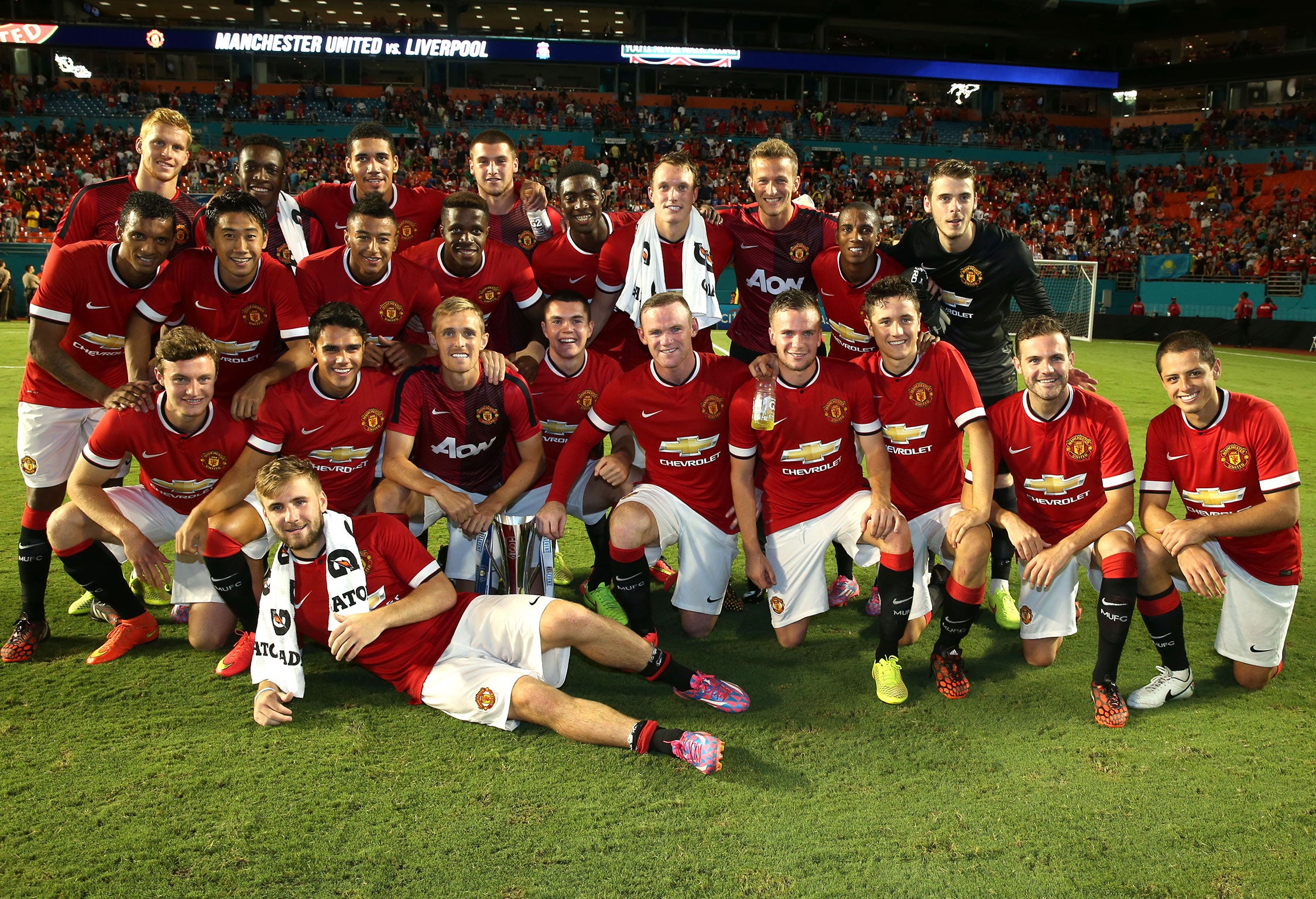 United players celebrate with the trophy