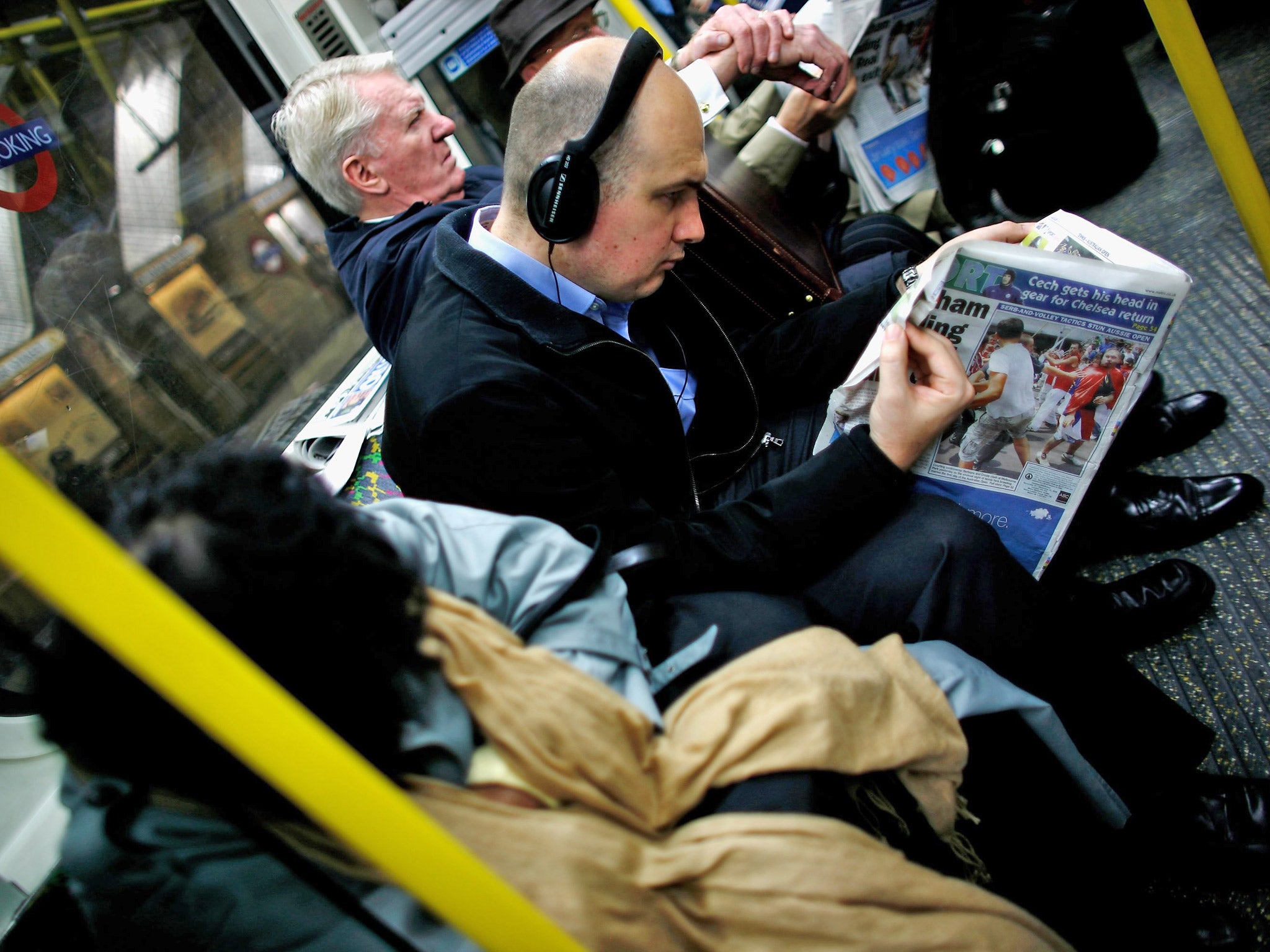 Headphones allow commuters to cut themselves off from the ambient soundscape (Getty)