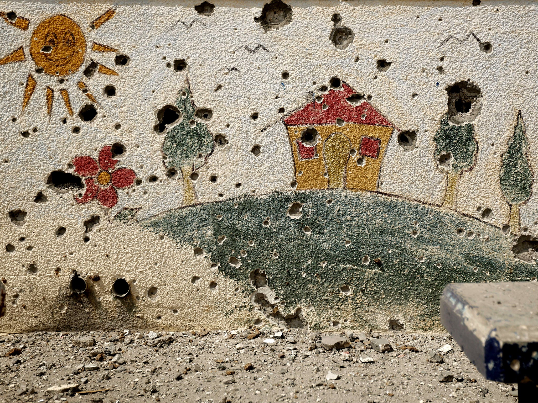 A shrapnel-holed wall in the Sobhi Abu Karsh school in Gaza City’s al-Shejaea neighbourhood