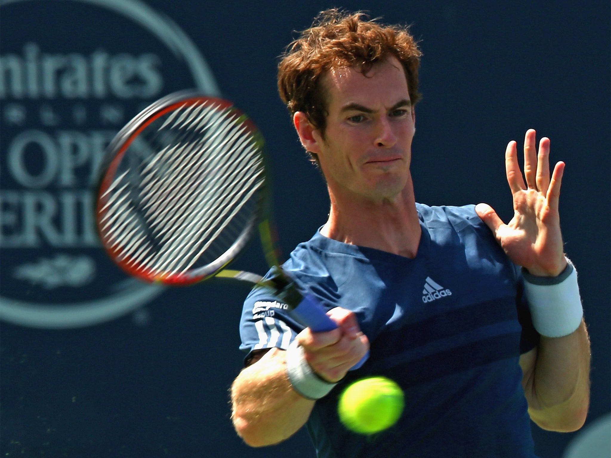 Britain’s Andy Murray returns a shot to Australia’s Nick Kyrgios in Toronto