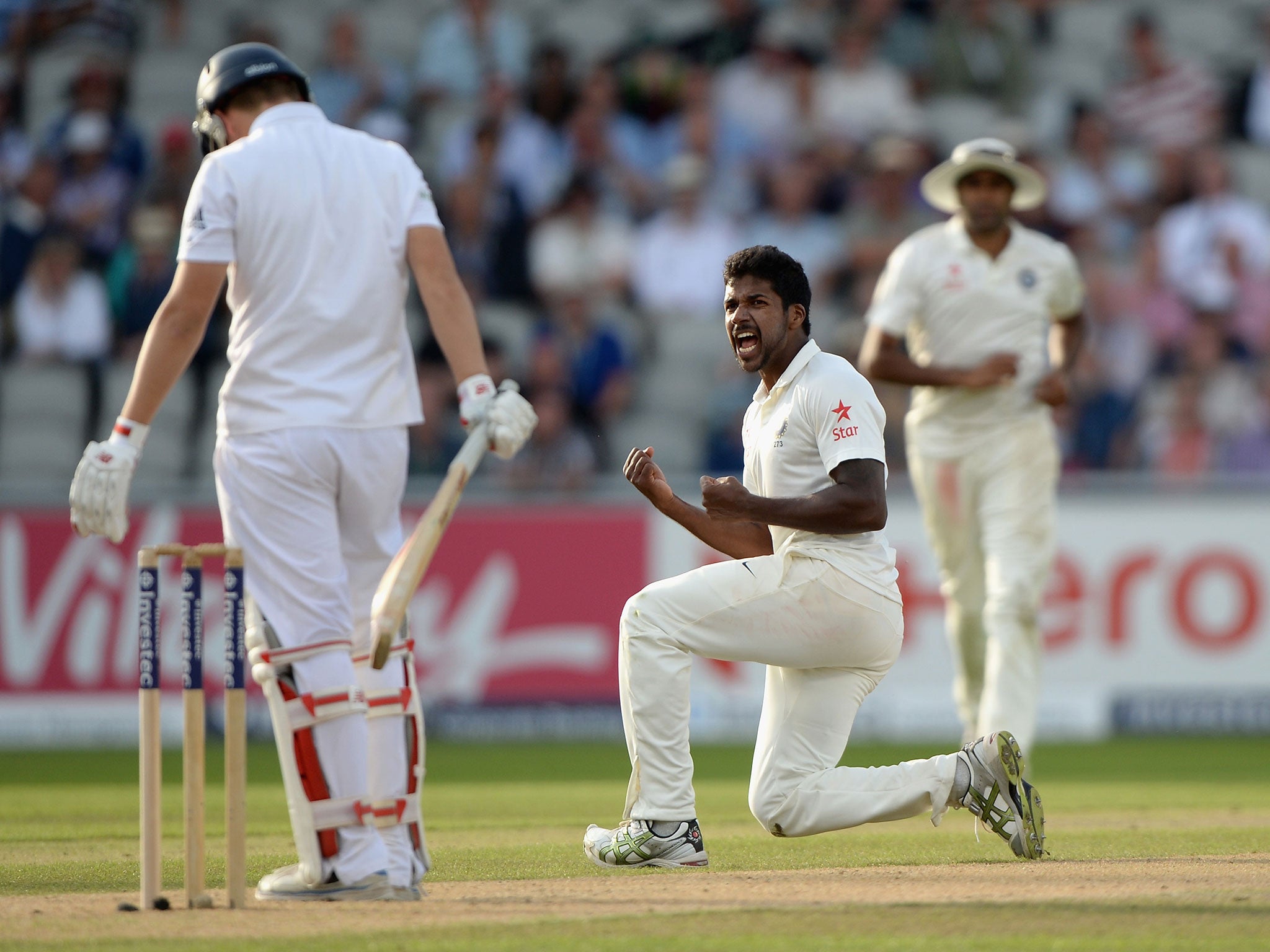 India’s Varun Aaron celebrates taking the wicket of England’s Gary Ballance