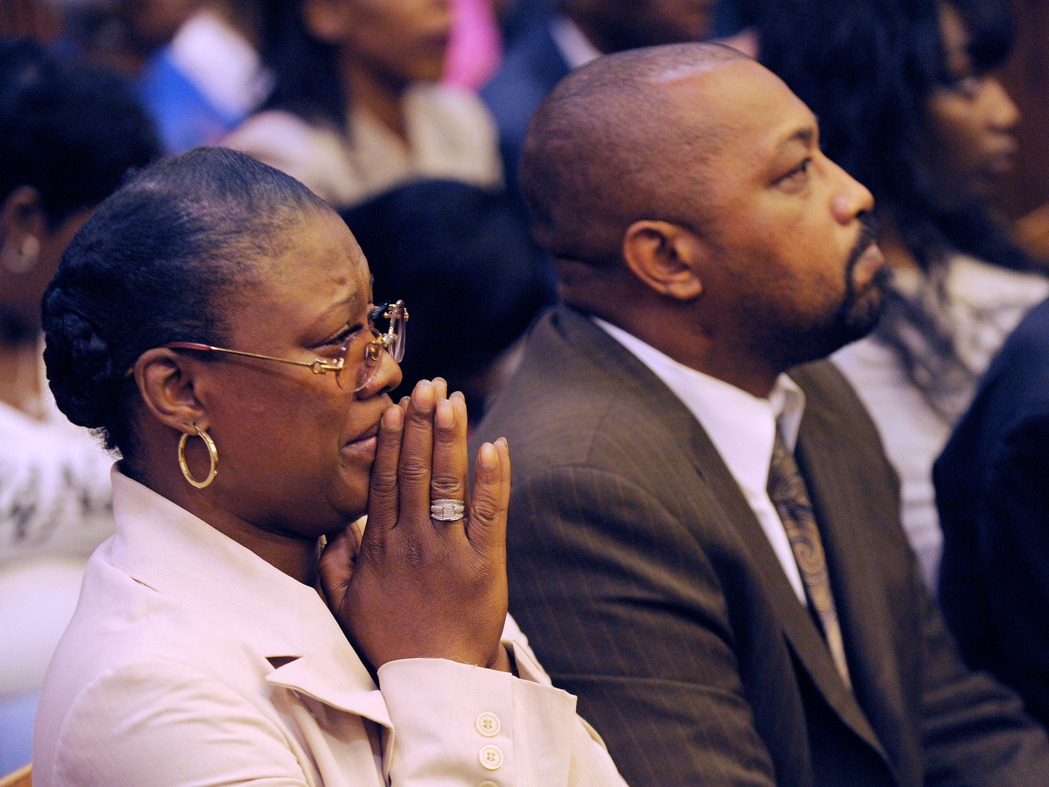 Monica McBride, mother of Renisha McBride, cries during the reading of verdict of guilty of of second-degree murder and manslaughter for Theodore Wafer. Walter Ray Simmons, Renisha's father, is by her side