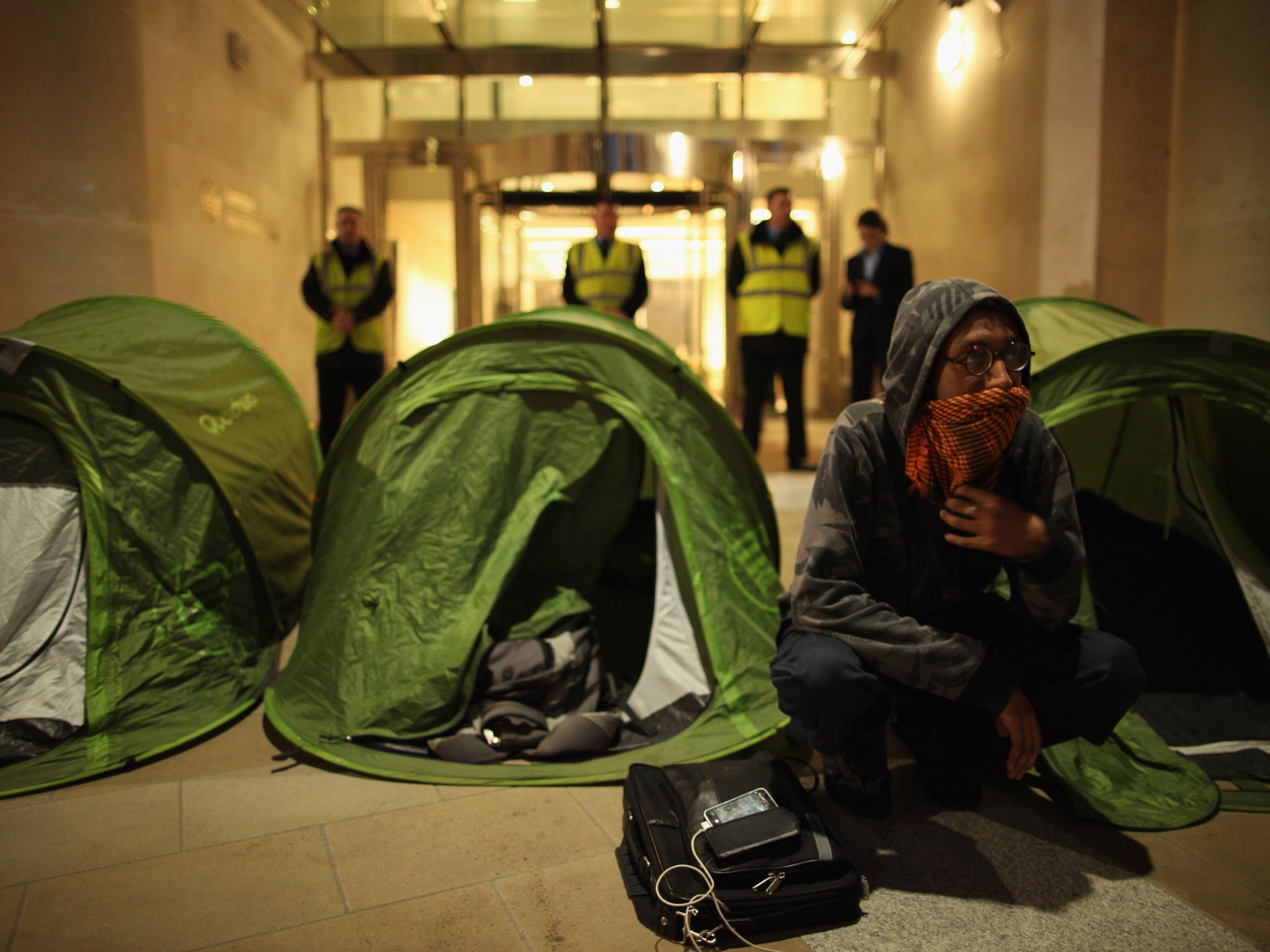 Anti-capitalist protesters from the 'Occupy' movement set up tents outside the stock exchange in Paternoster Square, which is adjacent to St Paul's Cathedral, their previous place of occupation on May 1, 2012 in London, England.