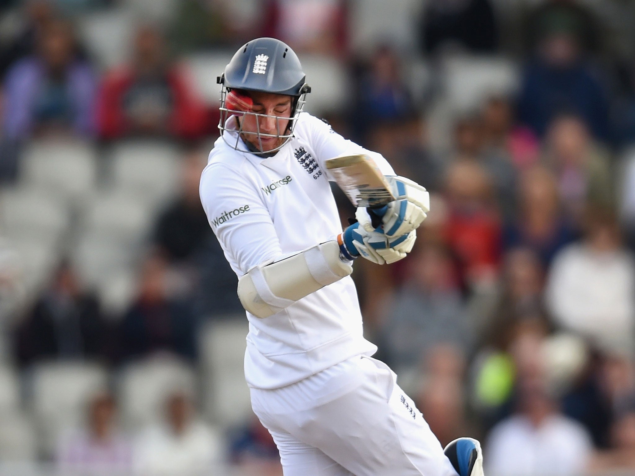 Stuart Broad is hit in the face by a Varun Aaron bouncer