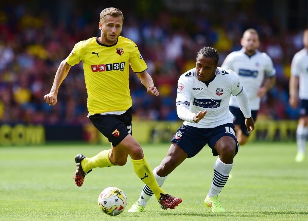 Neil Danns of Bolton Wanderers chases the ball