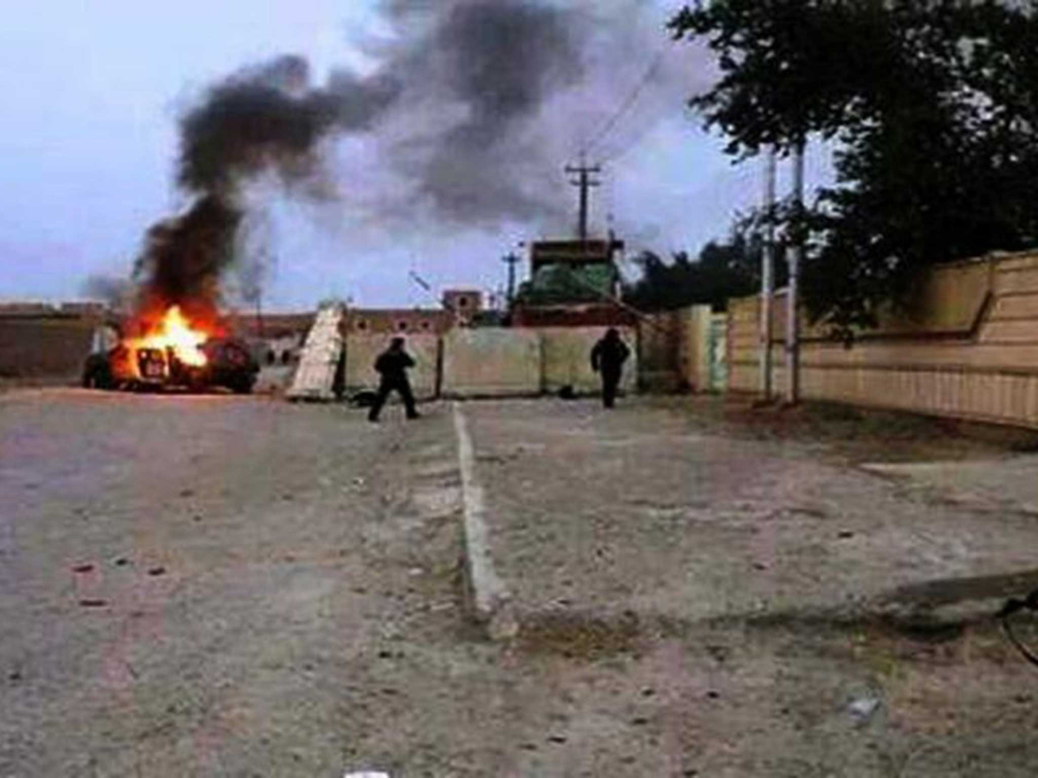 A vehicle belonging to Iraqi forces on fire in Mosul