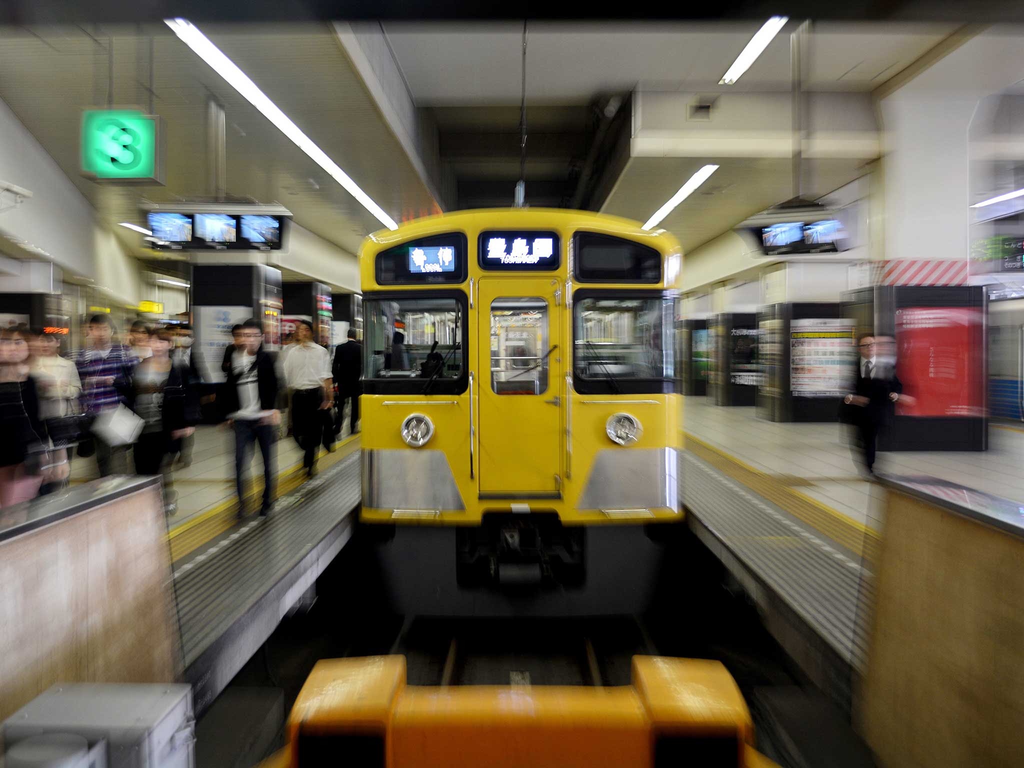 Tokyo's railway carriage is a model of quiet calm