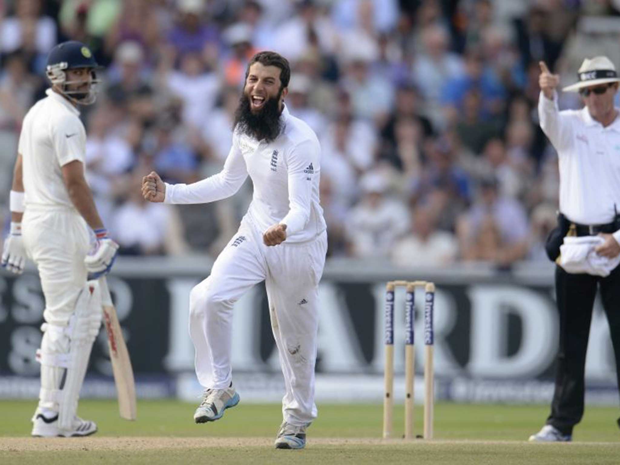 Ali shuffle: Moeen Ali of England celebrates dismissing Cheteshwar Pujara of India at Old Trafford