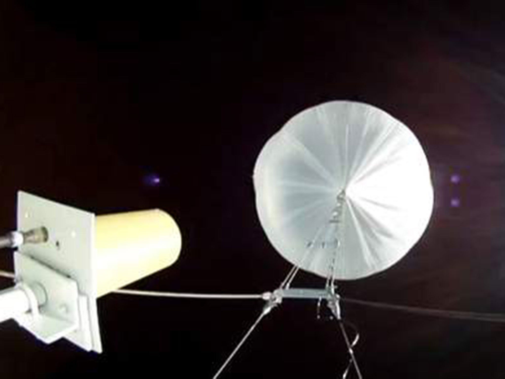 The video of the saucer, which was launched from Hawaii on the 28 June, shows it being propelled 120,000ft into orbit by a giant balloon.