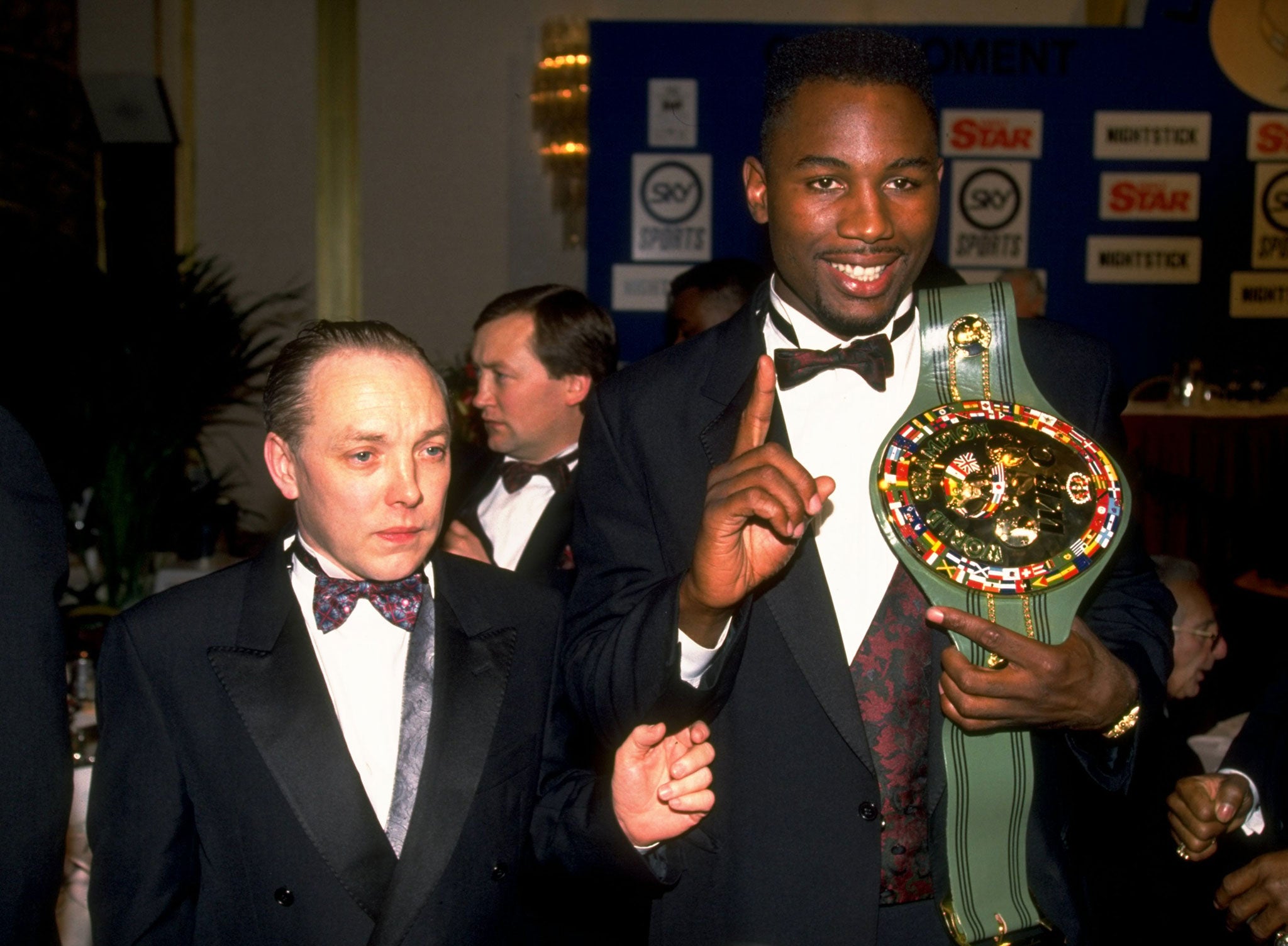 Lennox Lewis shows off his WBC belt with his manager Maloney