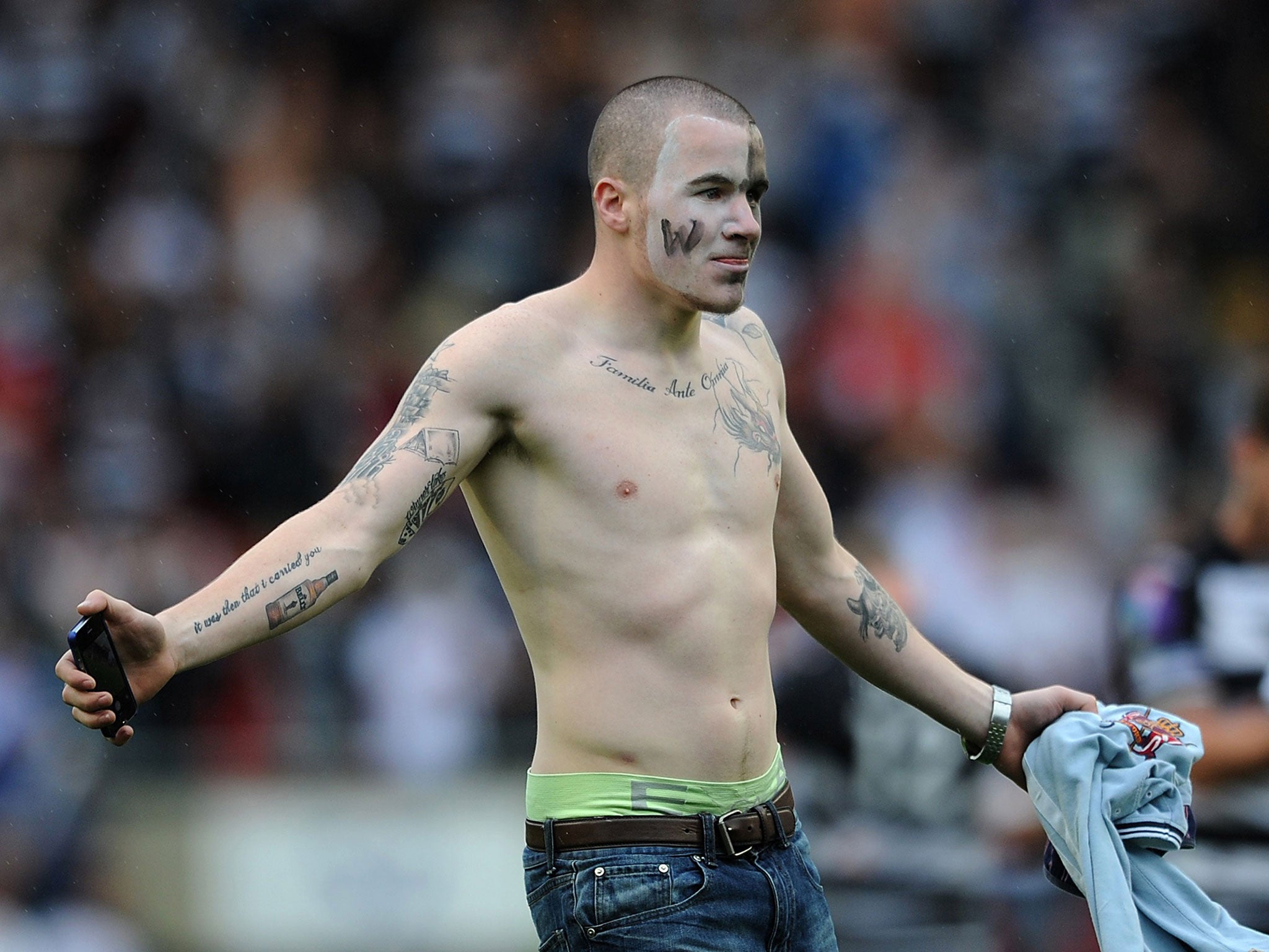 A Widnes Vikings fan runs onto the pitch after the Challenge Cup semi-final defeat to Castleford