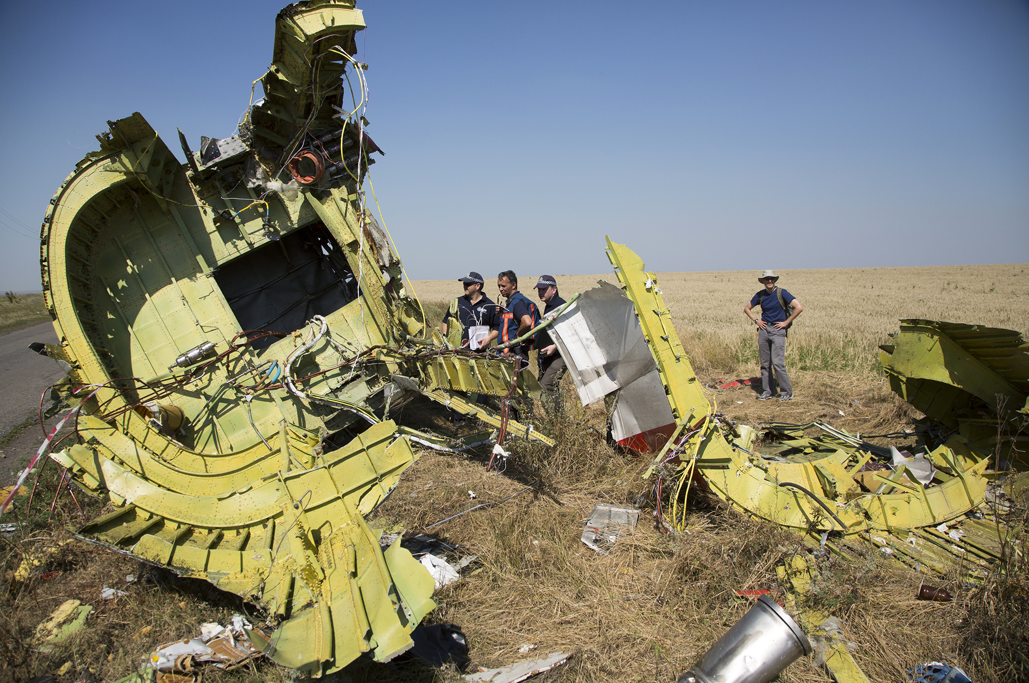 Australian and Dutch investigators examine pieces of the Malaysia Airlines Flight 17 plane crash in the village of Hrabove, Donetsk region, eastern Ukraine