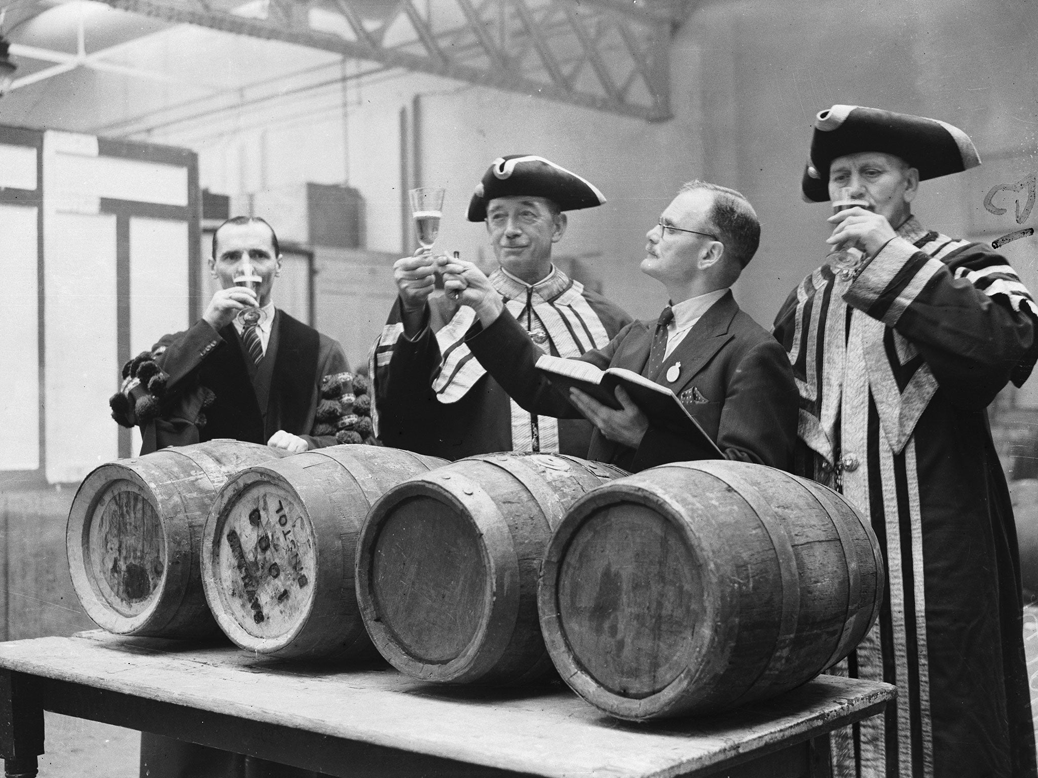 Booze choose: three 'aleconners' perform a taste-test on beer at the Brewers' Exhibition in London in 1936