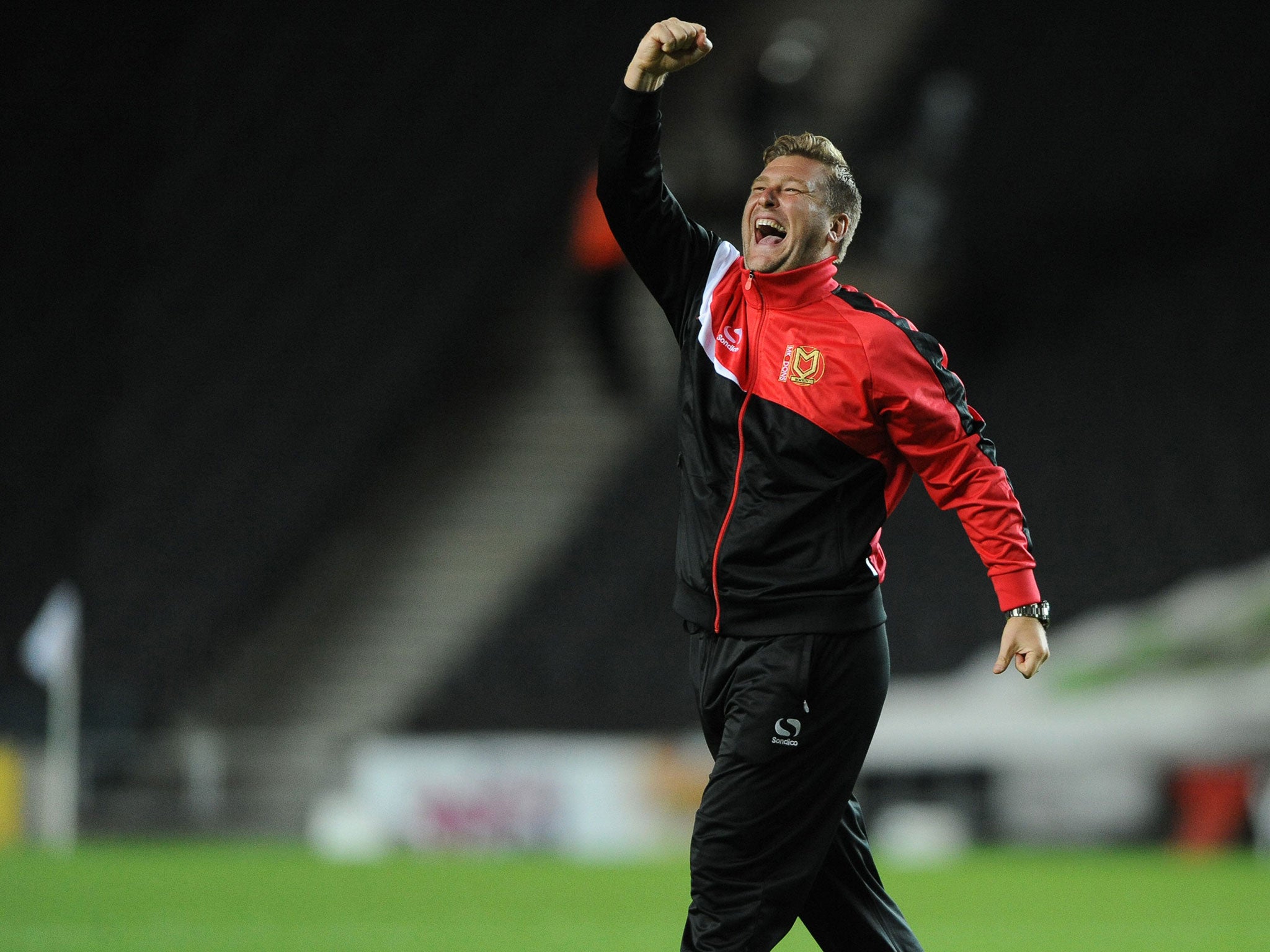 Karl Robinson, the highly rated MK Dons manager, will be able to test himself against Louis van Gaal