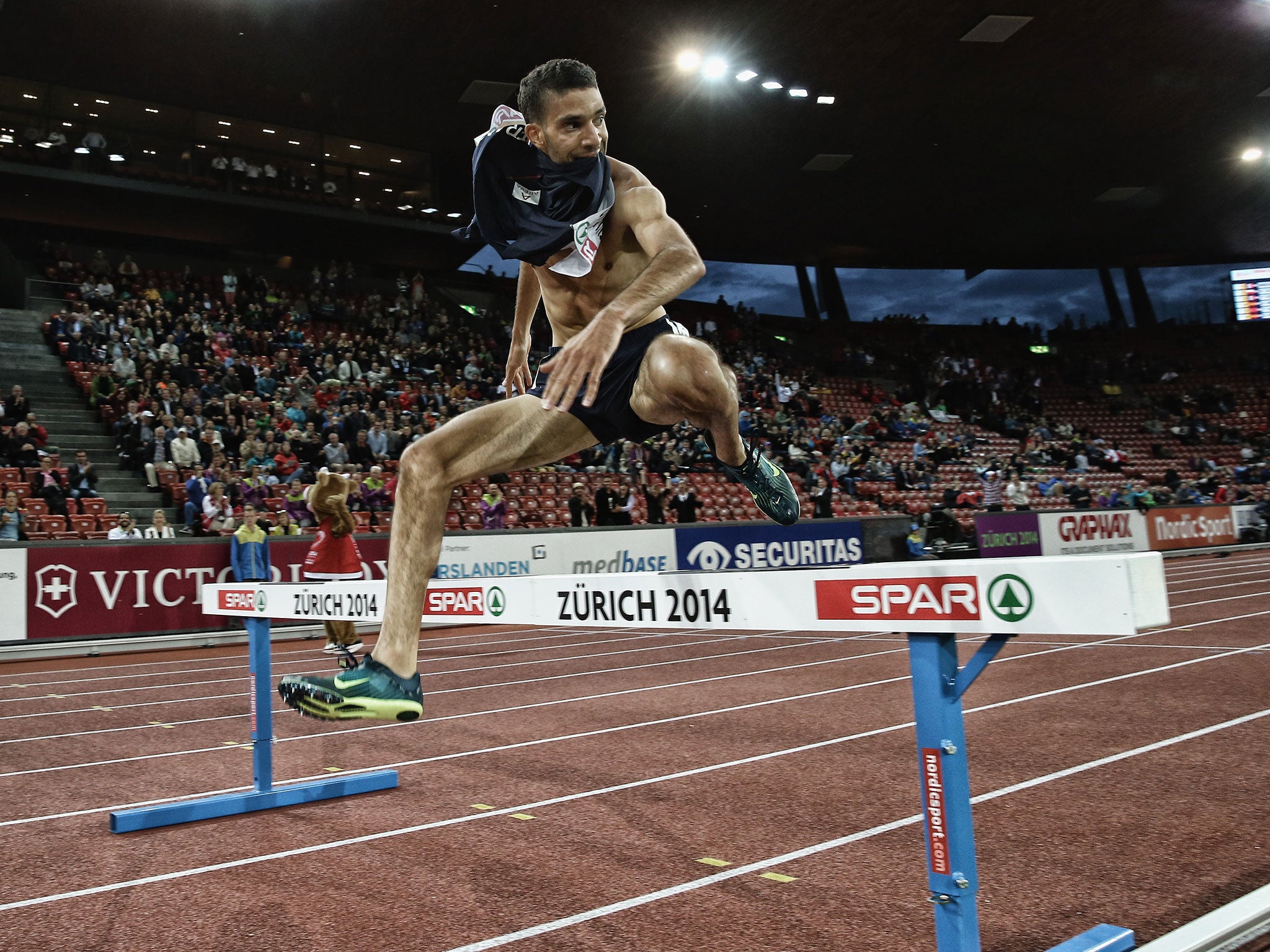 Mekhissi-Benabbad jumps the final hurdle with his vest in his mouth