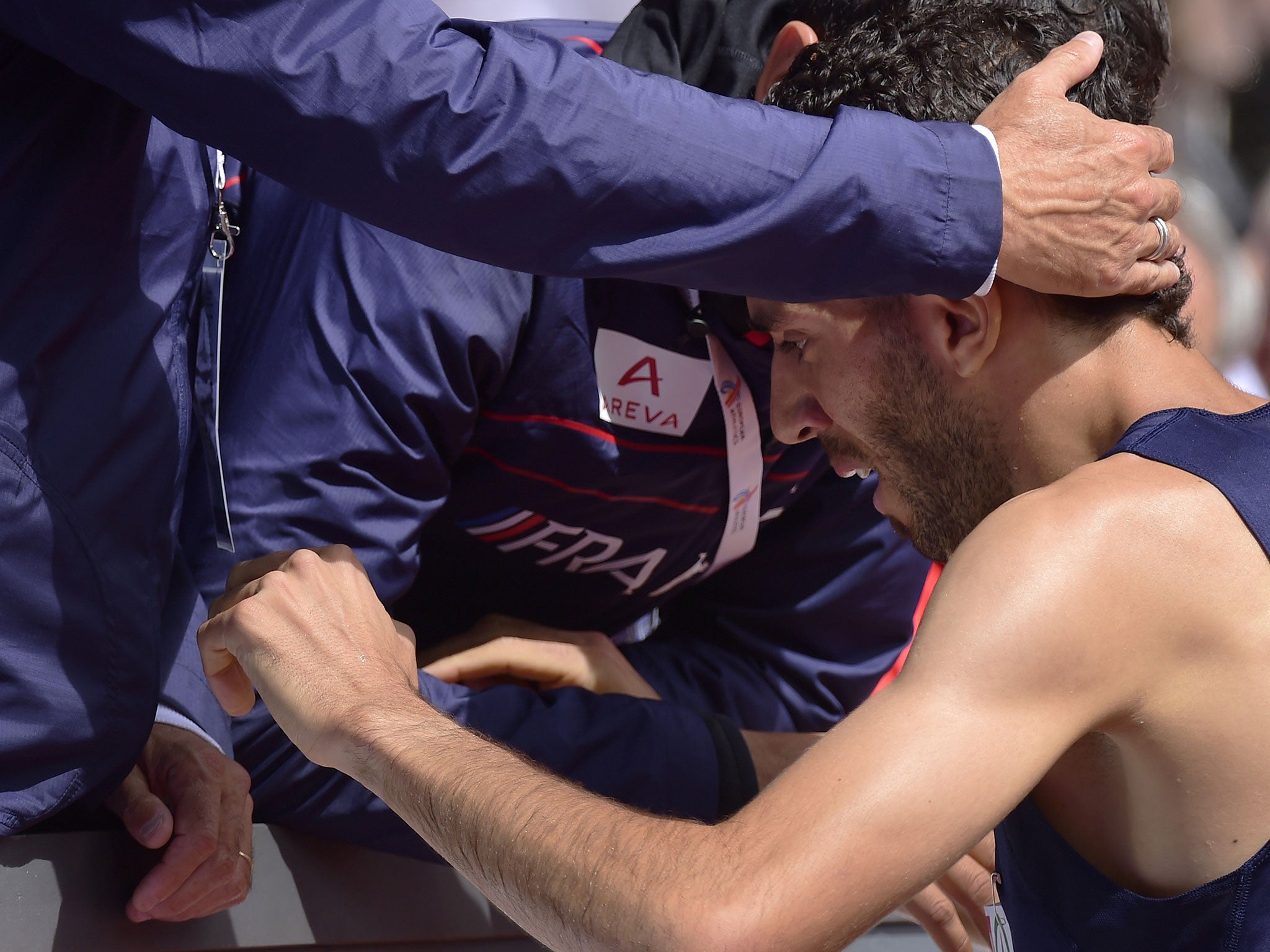 Mekhissi-Benabbad is consoled by his coaches