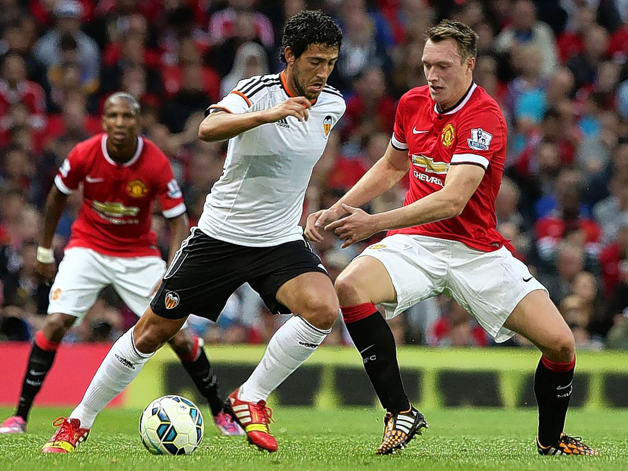 Phil Jones (right) in action against Valencia on Tuesday has mostly occupied the sweeper’s role for Manchester United in pre-season