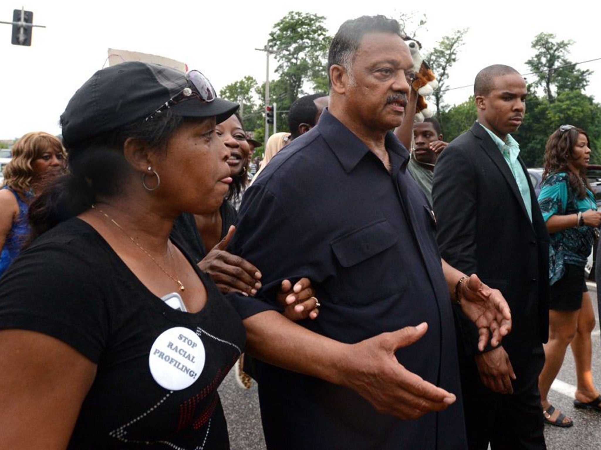 US civil rights leader, Reverend Jesse Jackson led demonstrators gathered to protest the shooting of Brown in Ferguson to the site where he was killed.