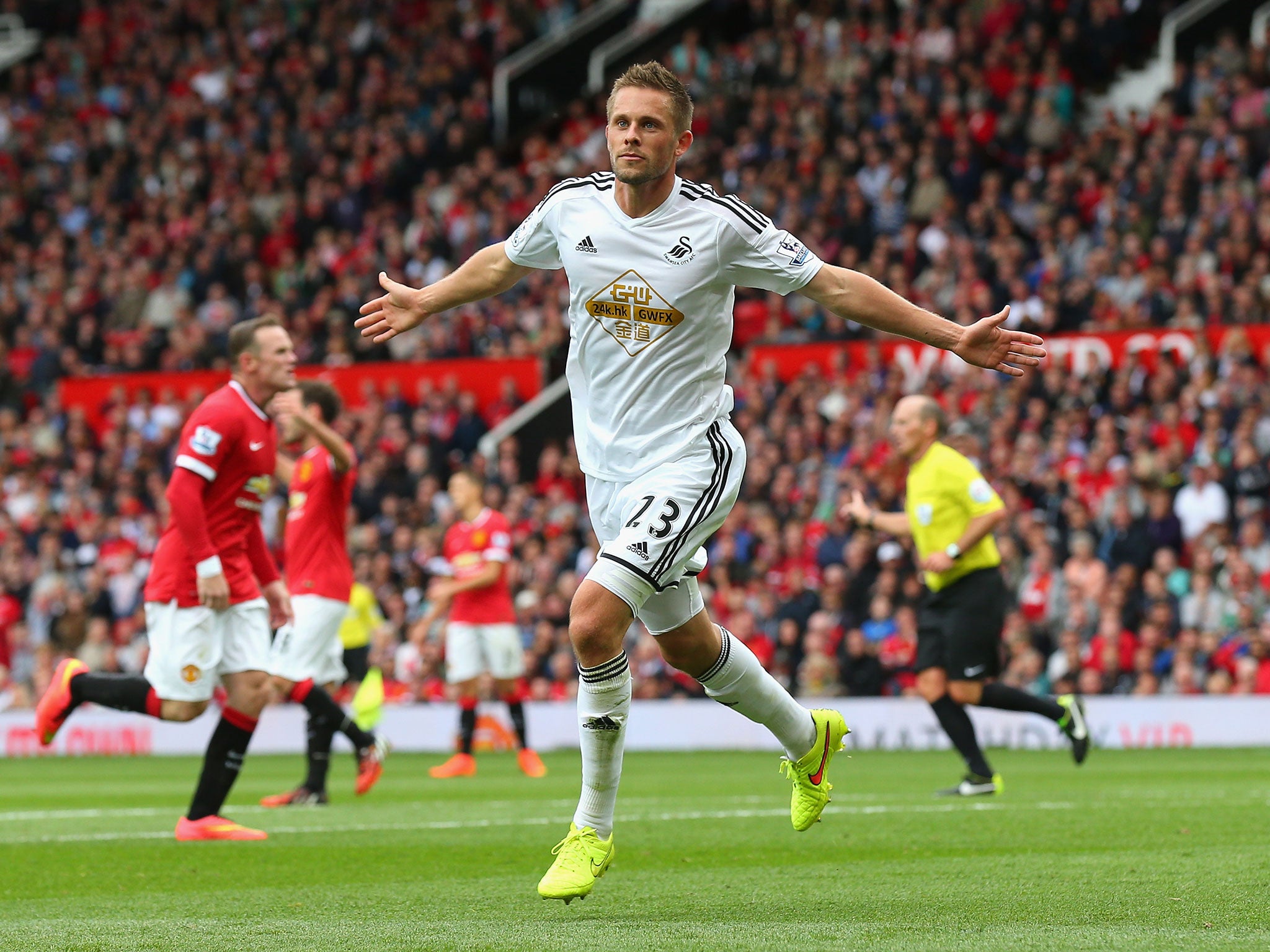 Gylfi Sigurdsson stunned Old Trafford for a second time in the same afternoon as he restored Swansea's lead following a goal-mouth scramble