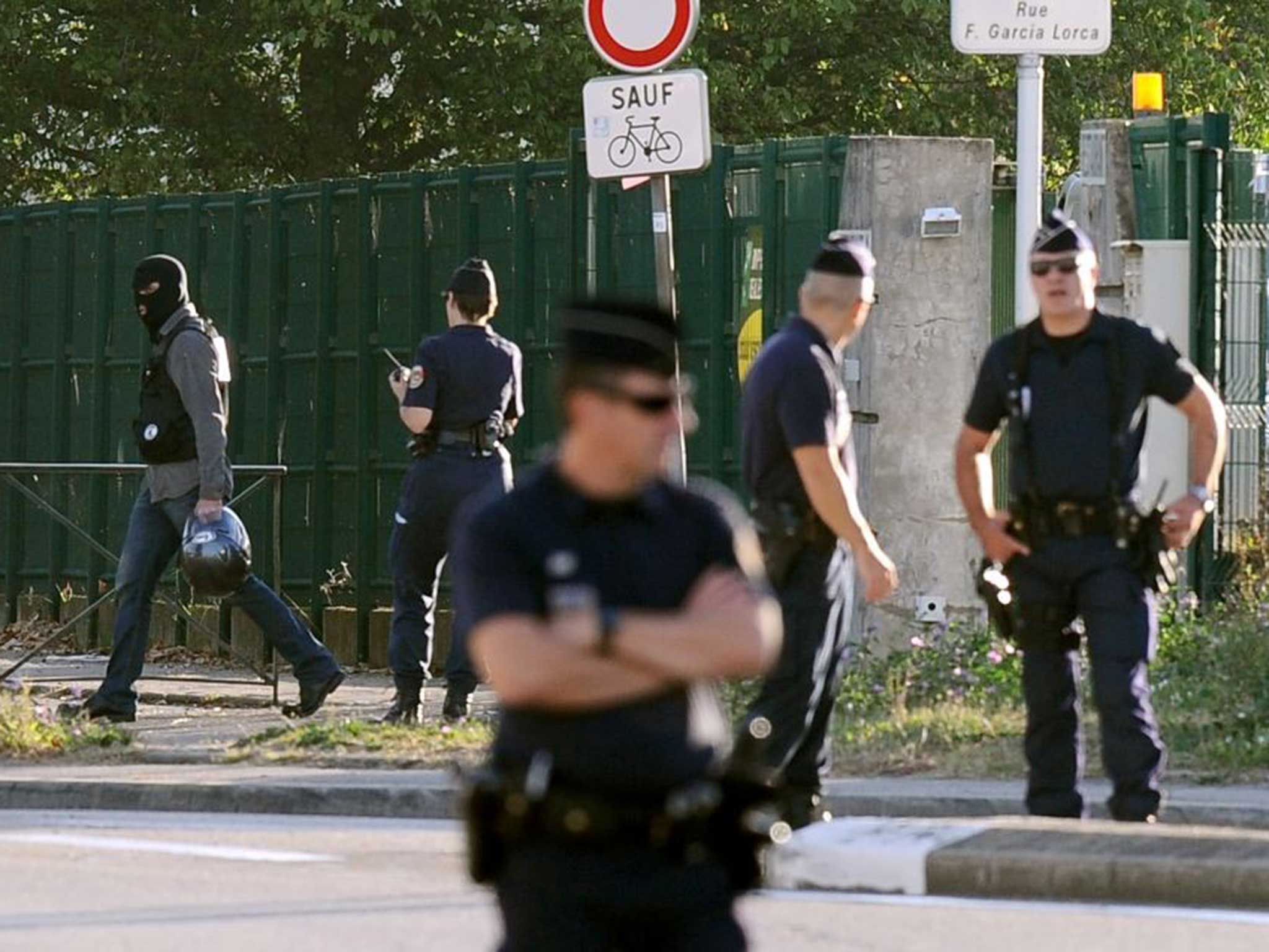 Police secure the scene from where gunman Mohamed Merah stole the scooter