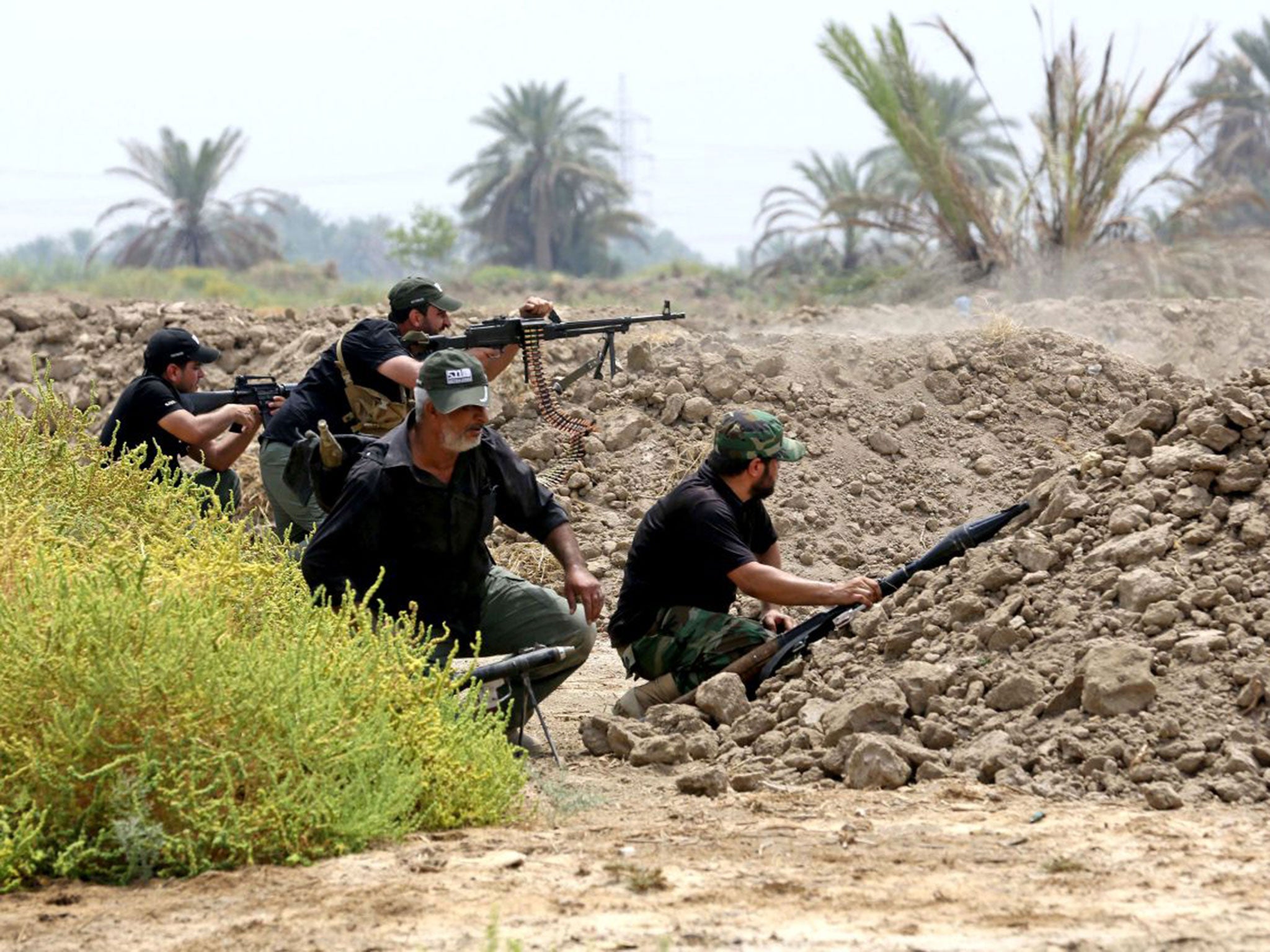 Iraqi Shia fighters prepare to fight Isis militants in Jurf Al Sakhar, 43 miles south of Baghdad