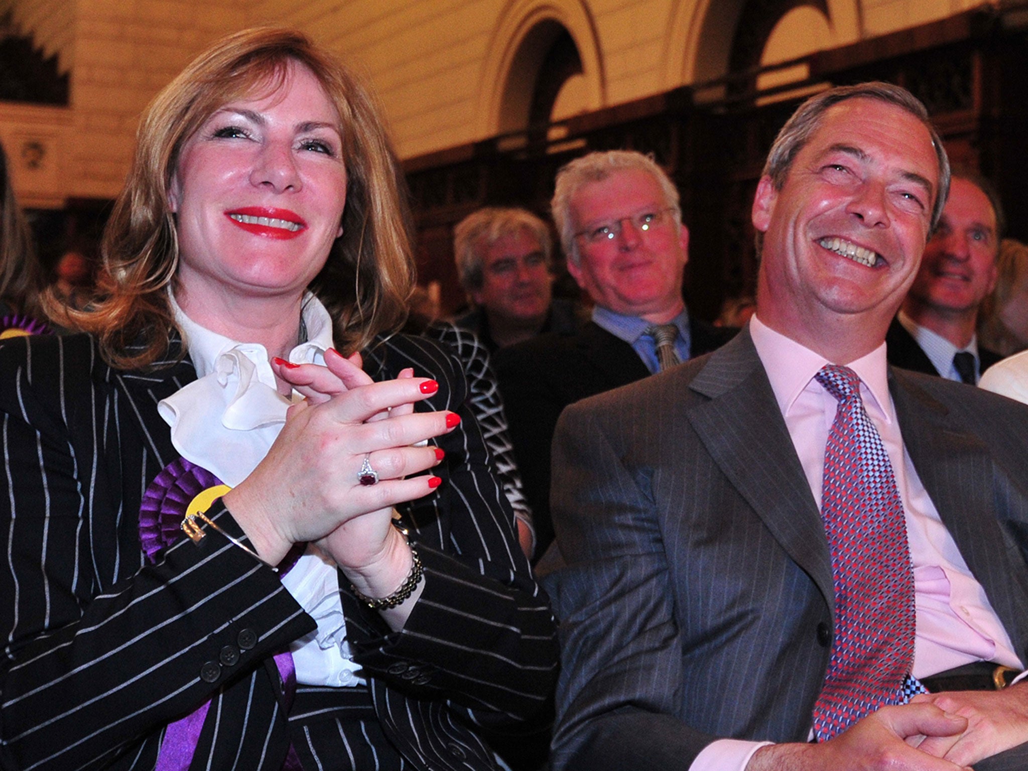 Nigel Farage sitting with UKIP MEP Janice Atkinson as the results of the European Parliament elections are declared