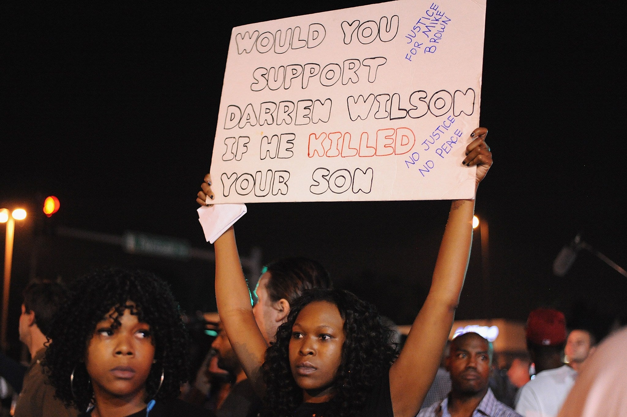 Children hold signs on 15 August