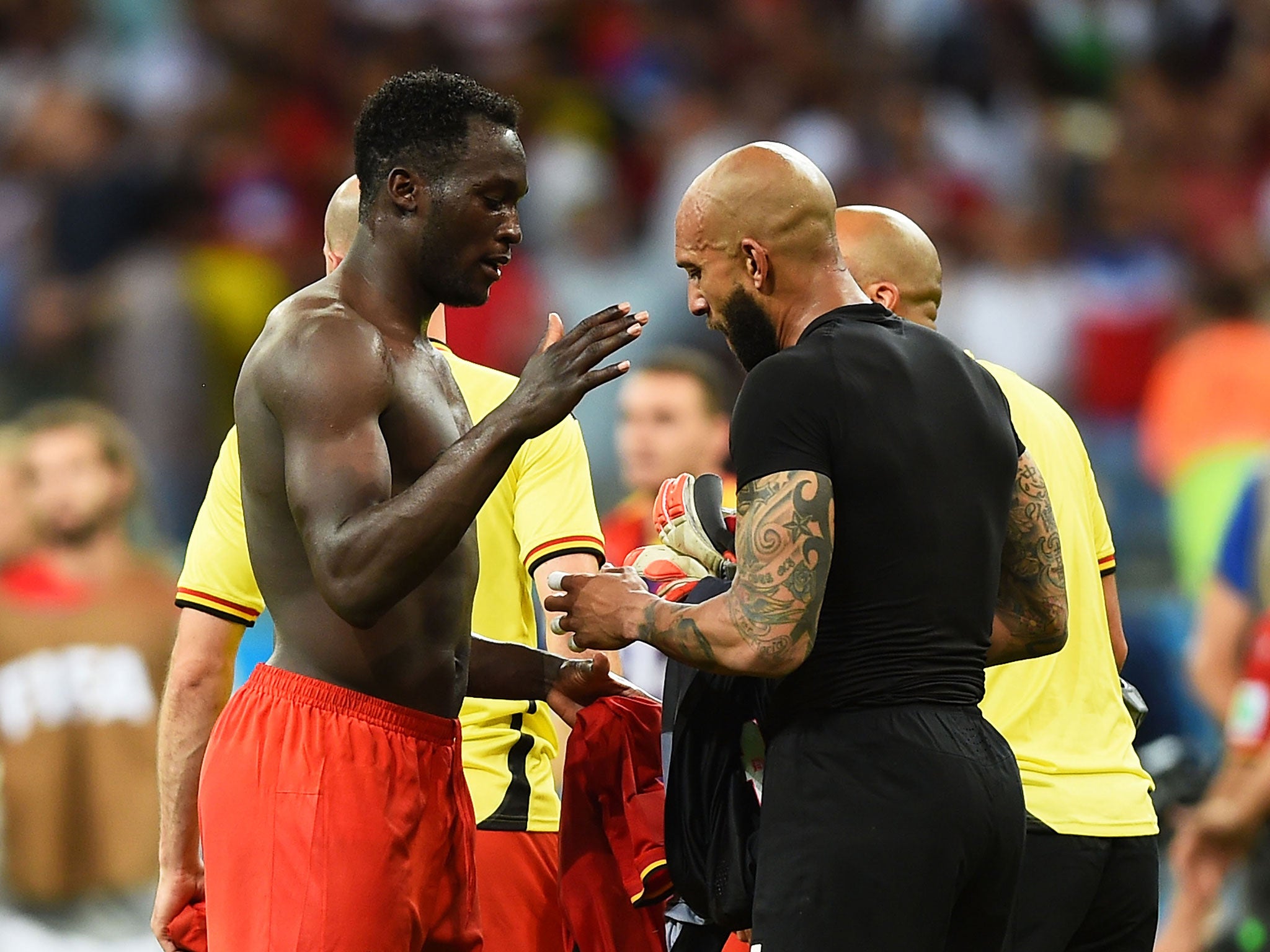 Howard and Romelu Lukaku swap shirts at the end of the World Cup last-16 tie - won by Belgium