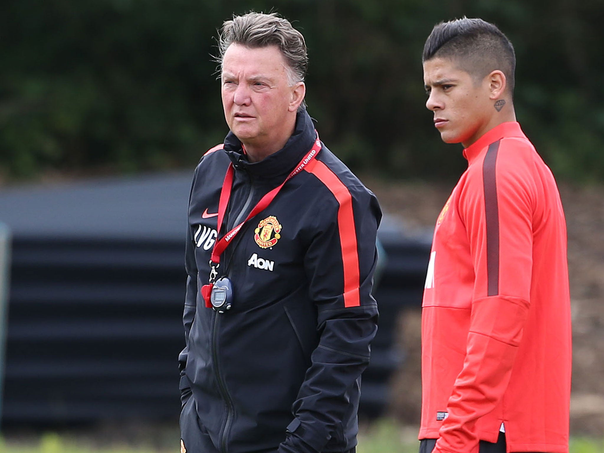 Van Gaal speaks to new boy Marcos Rojo during training