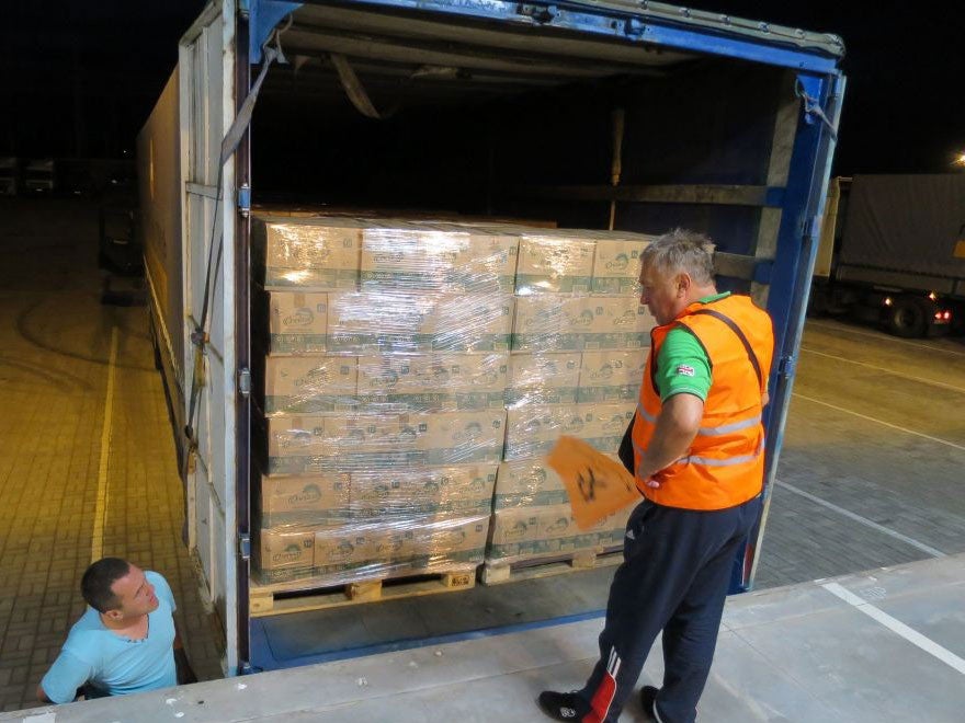 An employee inspects the contents of a truck with Russian humanitarian aid in Mariupol, Ukraine on 22 August 2014