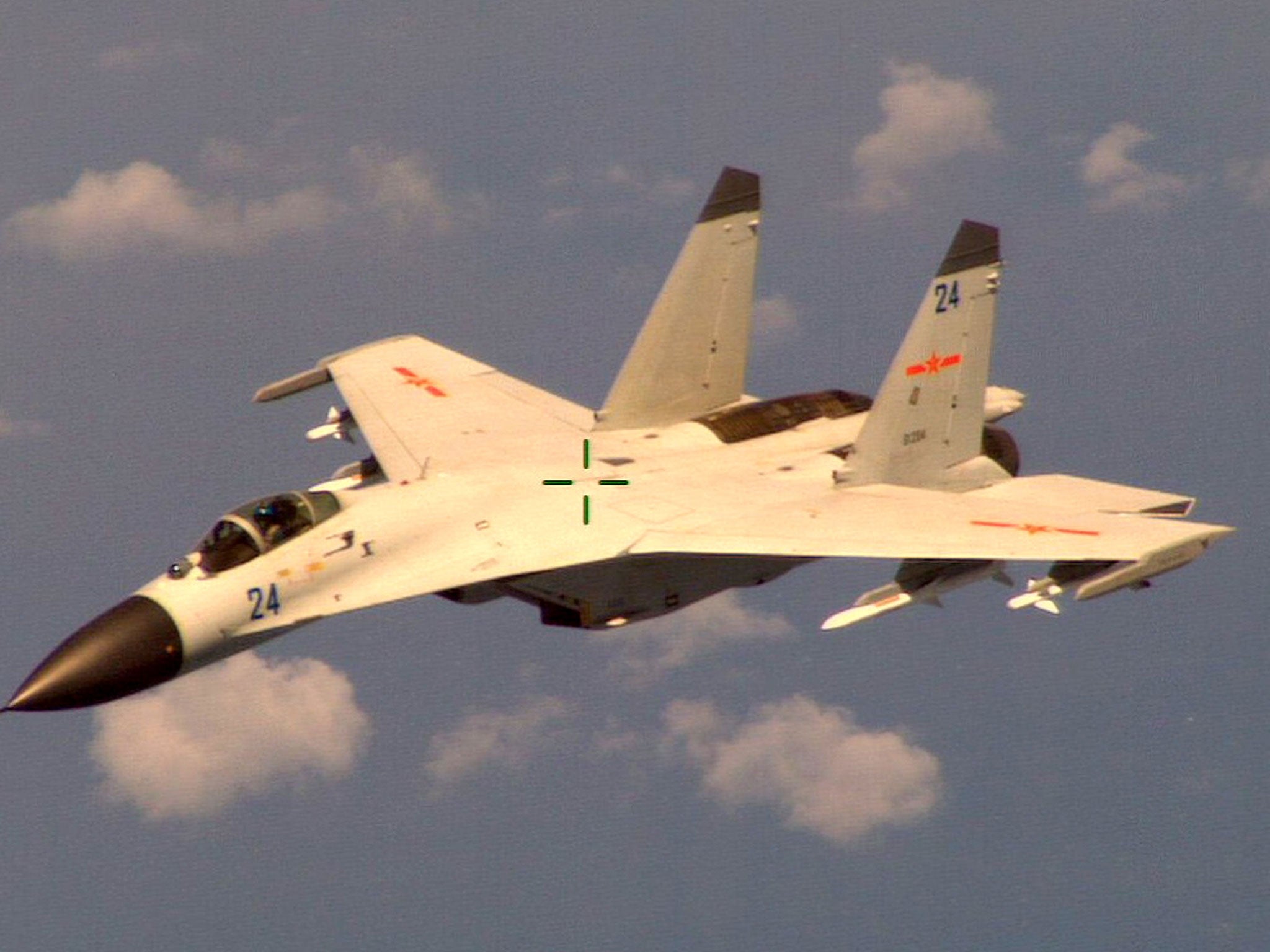 A Chinese fighter jet that the Obama administration said Friday conducted a "dangerous intercept" of a U.S. Navy surveillance and reconnaissance aircraft off the coast of China in international airspace
