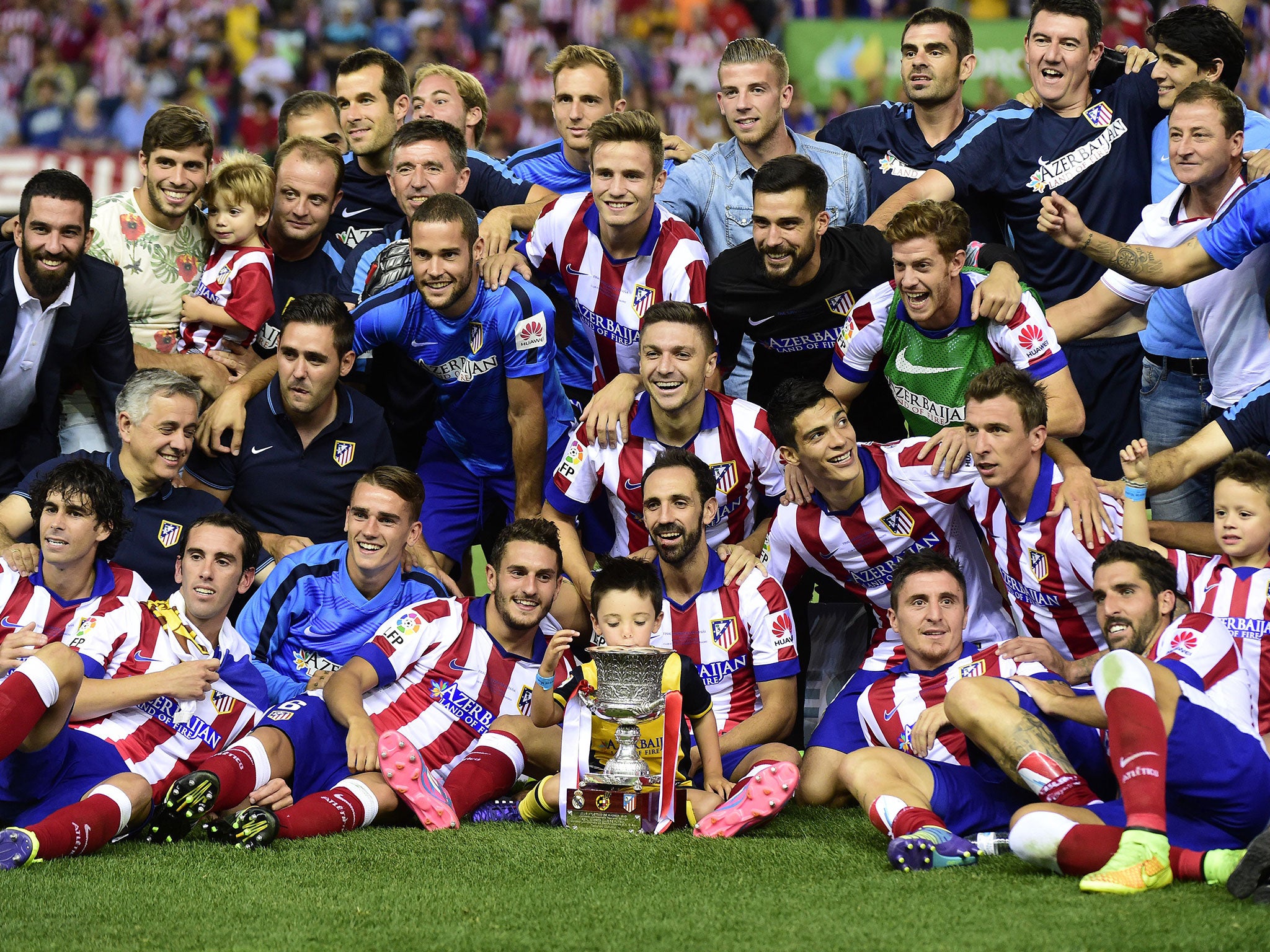 Atletico players celebrate after their victory