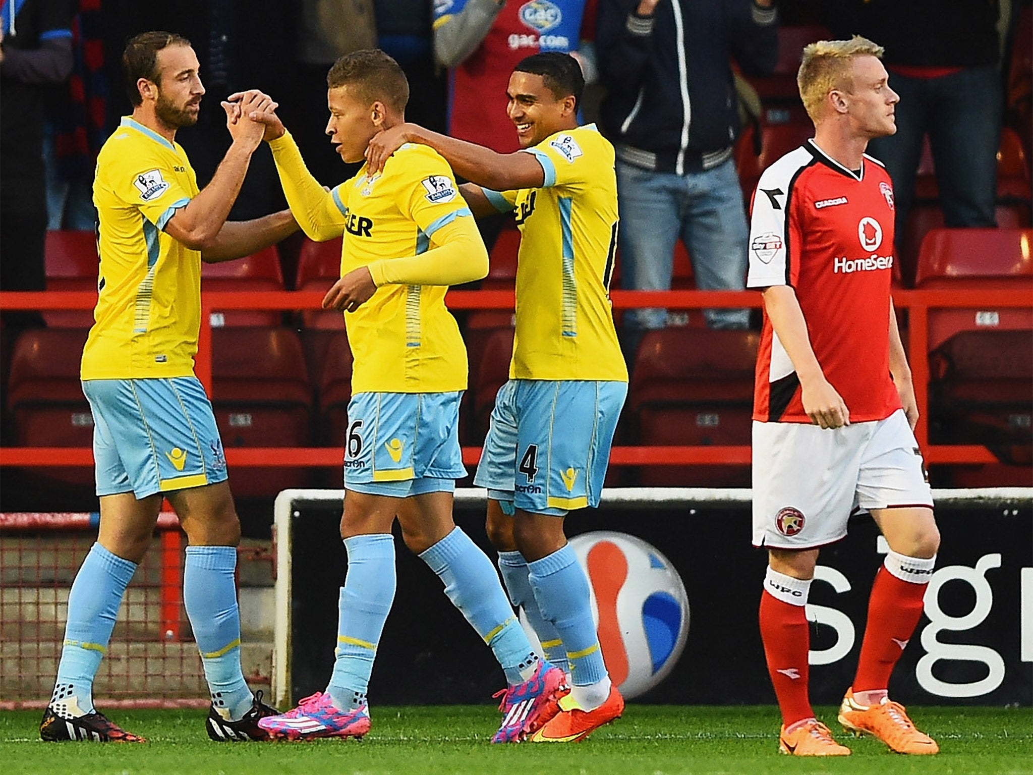 Dwight Gayle (centre) of Crystal Palace celebrates scoring the opening goal