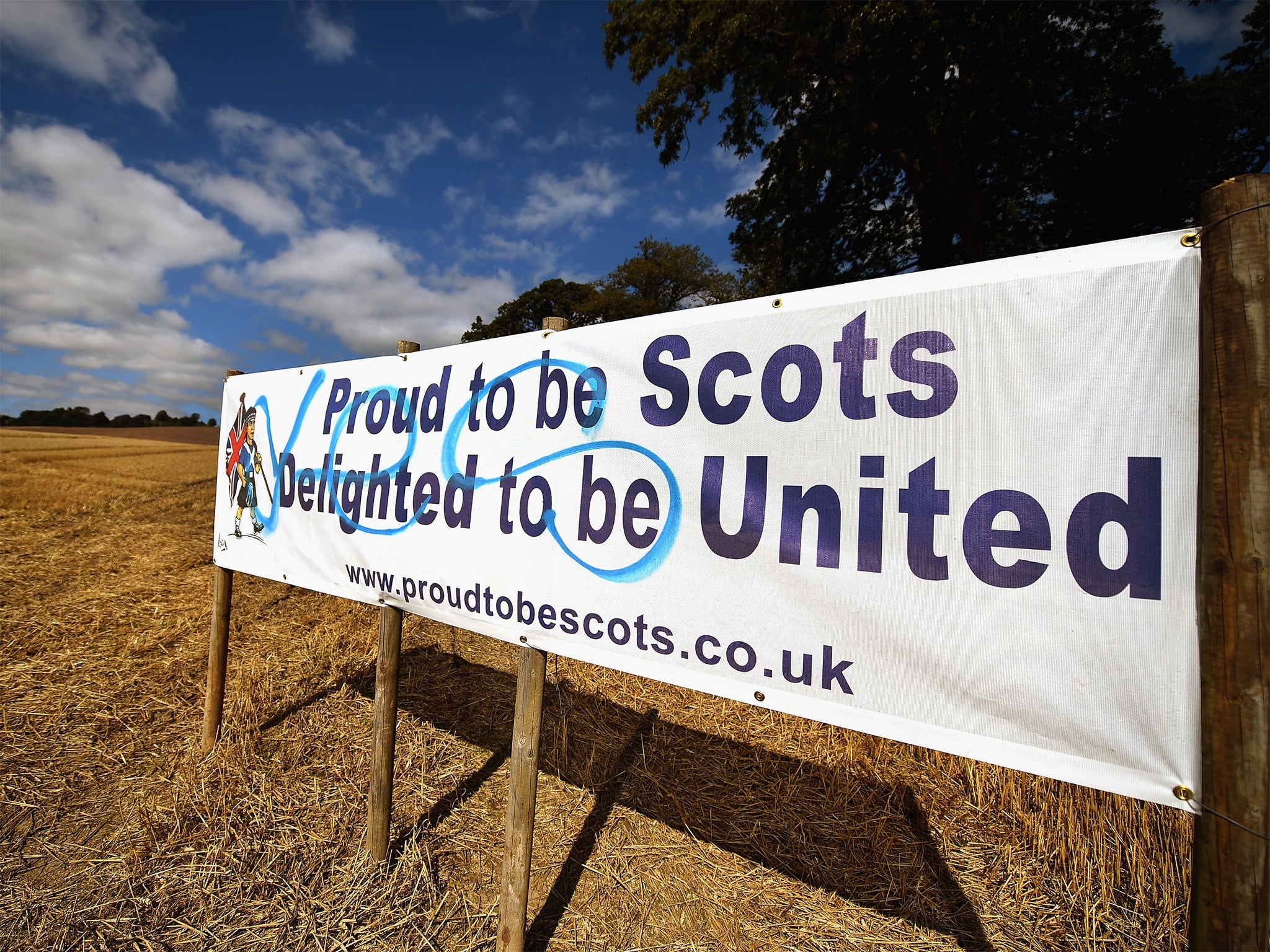 A Better Together campaign placard spray painted with yes graffiti in Dundee, Scotland