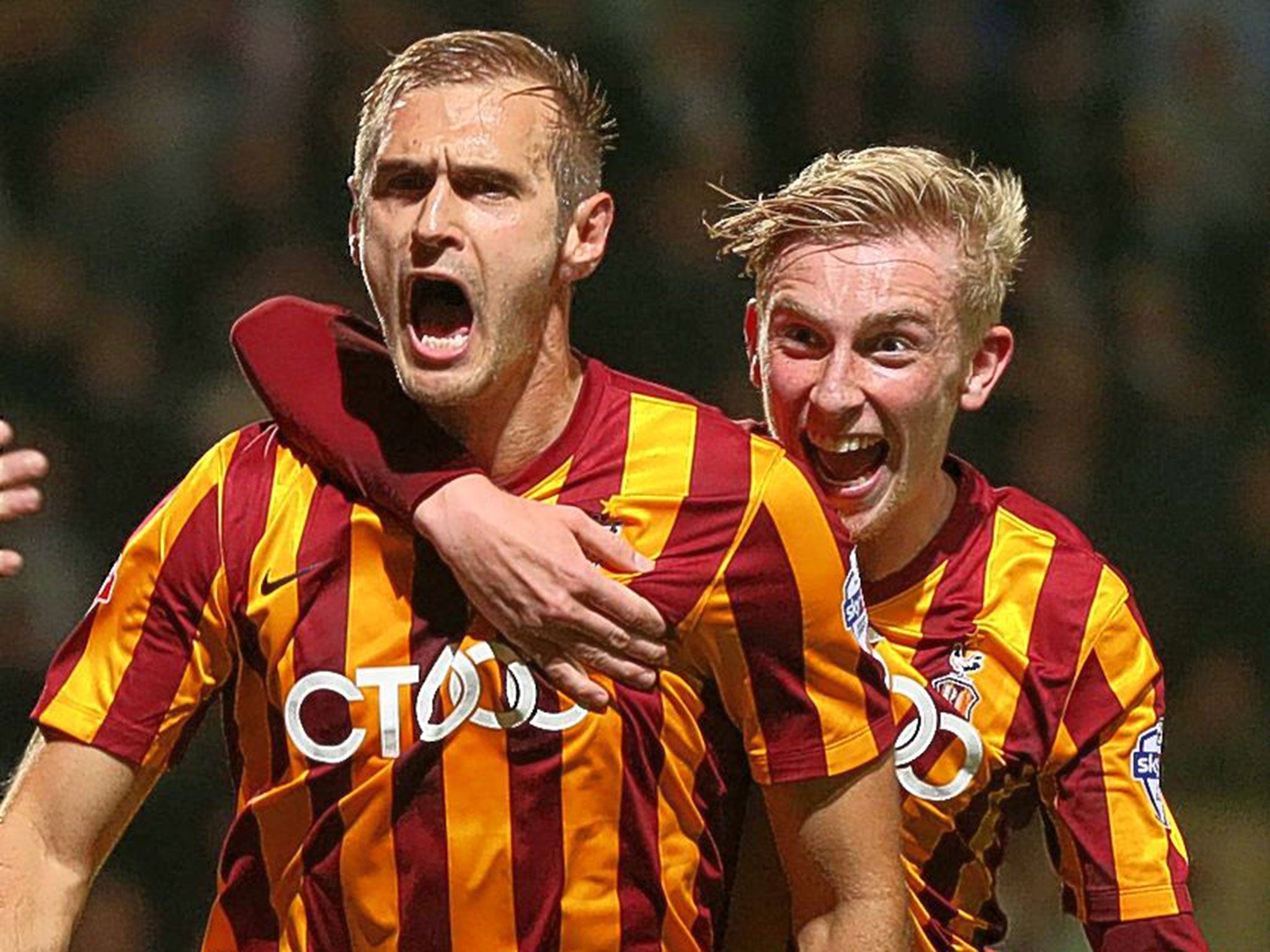 James Hanson (left) celebrates the winner for Bradford City after three late goals in four minutes saw them come from behind to beat Championship side Leeds