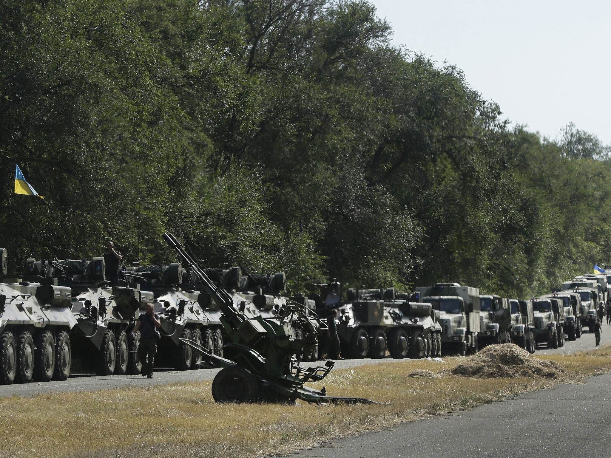 Ukrainian soldiers wait for the start of the march into the town of Mariupol. Pro-Russian rebel forces entered a key town of Novoazovsk in southeastern Ukraine on Wednesday
