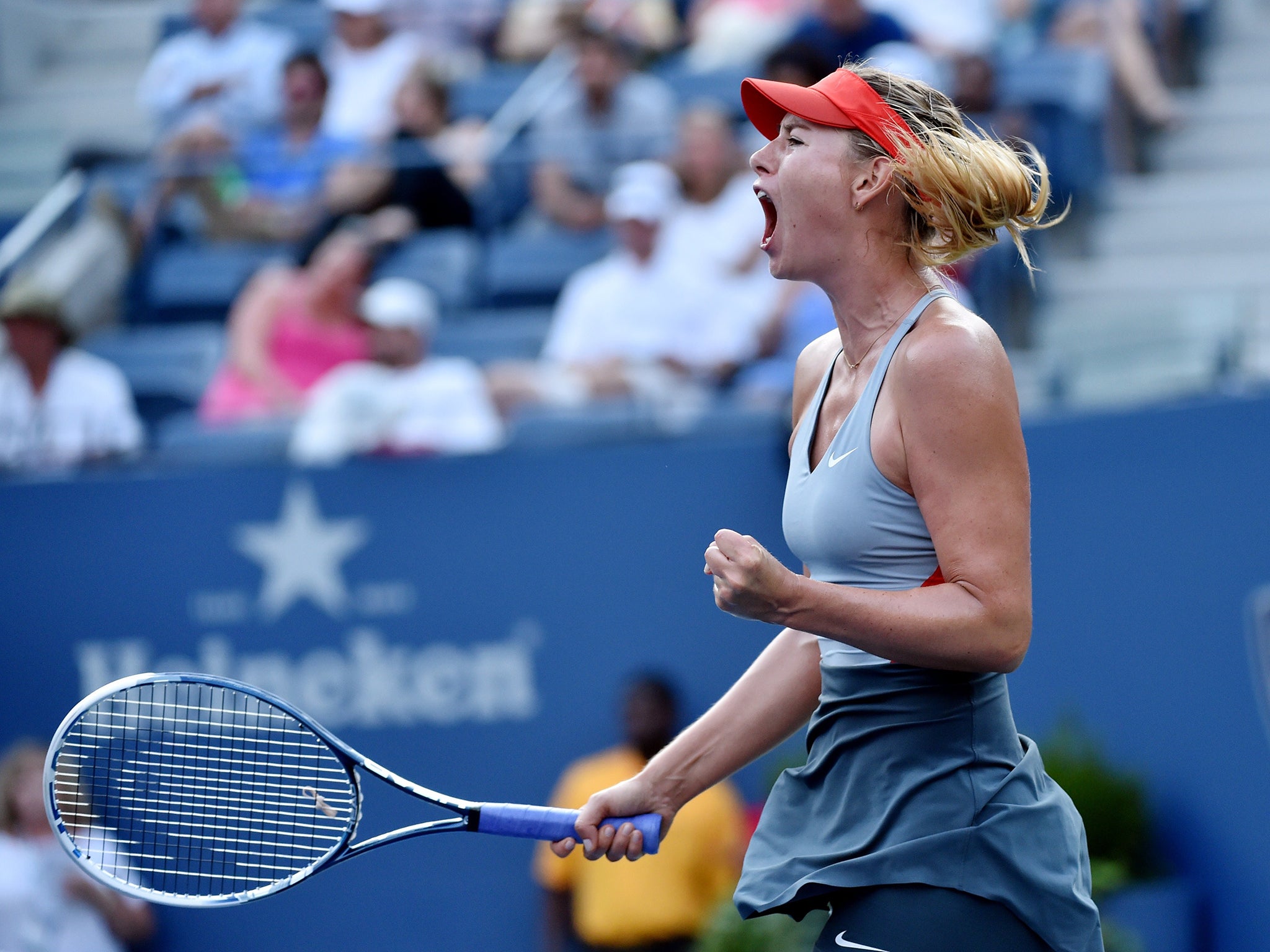 Maria Sharapova of Russia reacts to winning a game against Alexandra Dulgheru