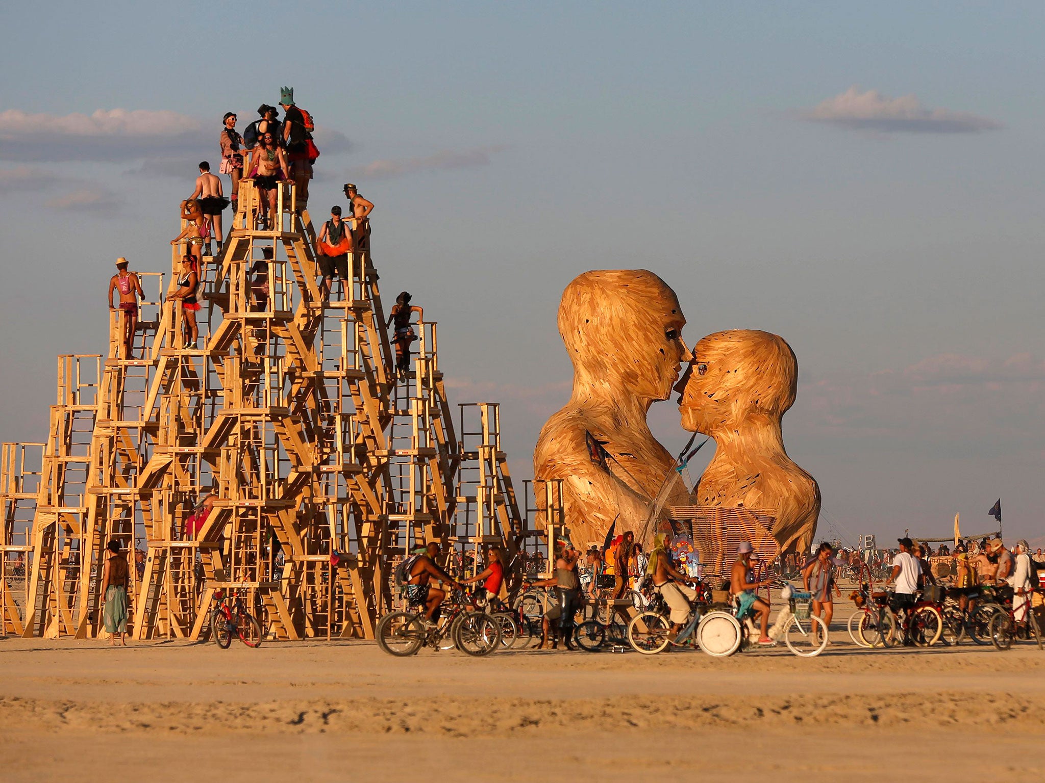 People interact with art installations during the Burning Man 2014 arts and music festival