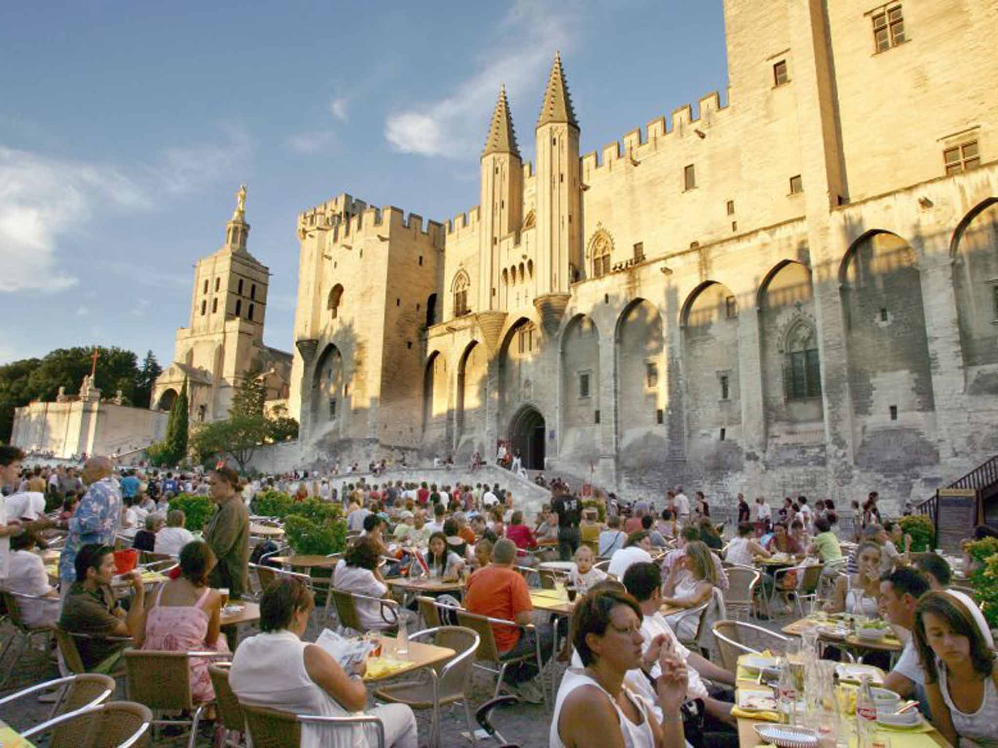 Cafe society: crowds gather outside Avignon's Palais des Papes