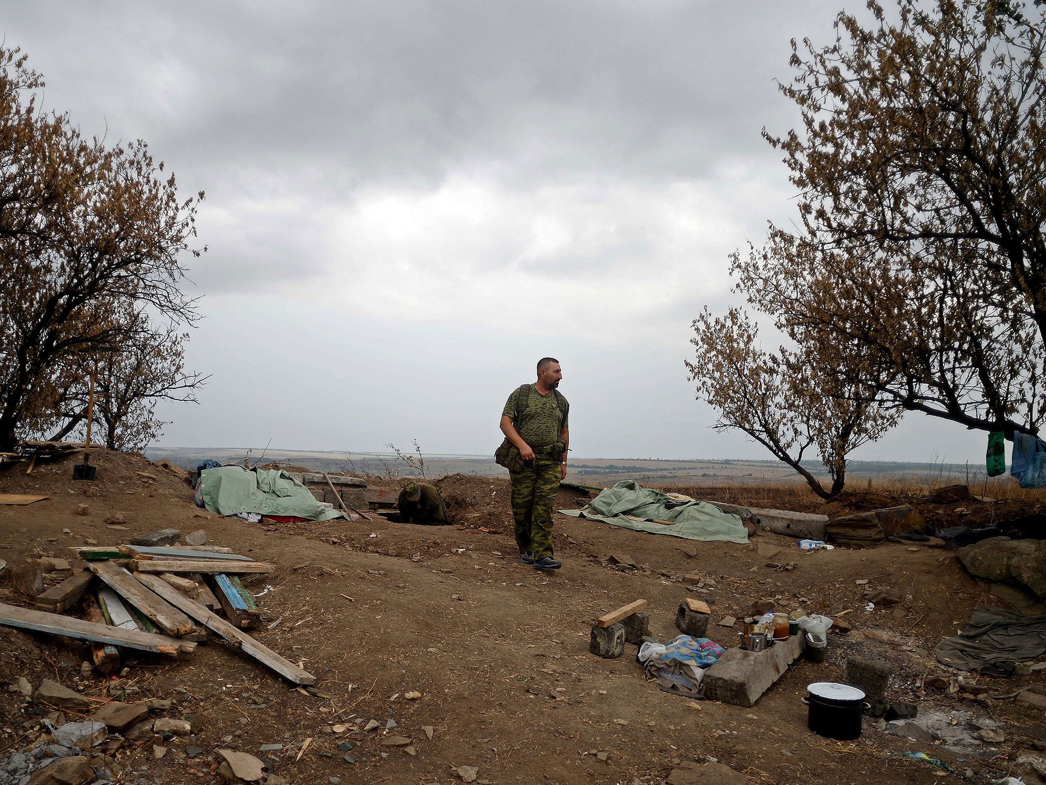 Pro-Russian fighters dig trenches in Troitsko-Khartsyzk, 30km east of Donetsk yesterday amid bombardments from Ukrainian government forces in the eastern region