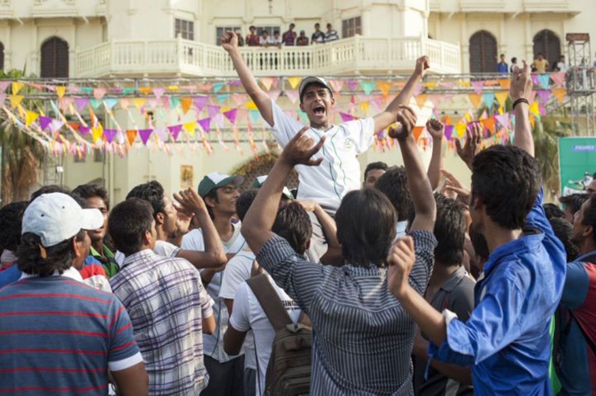 Rinku (Suraj Sharma) wins the Million Dollar Arm contest