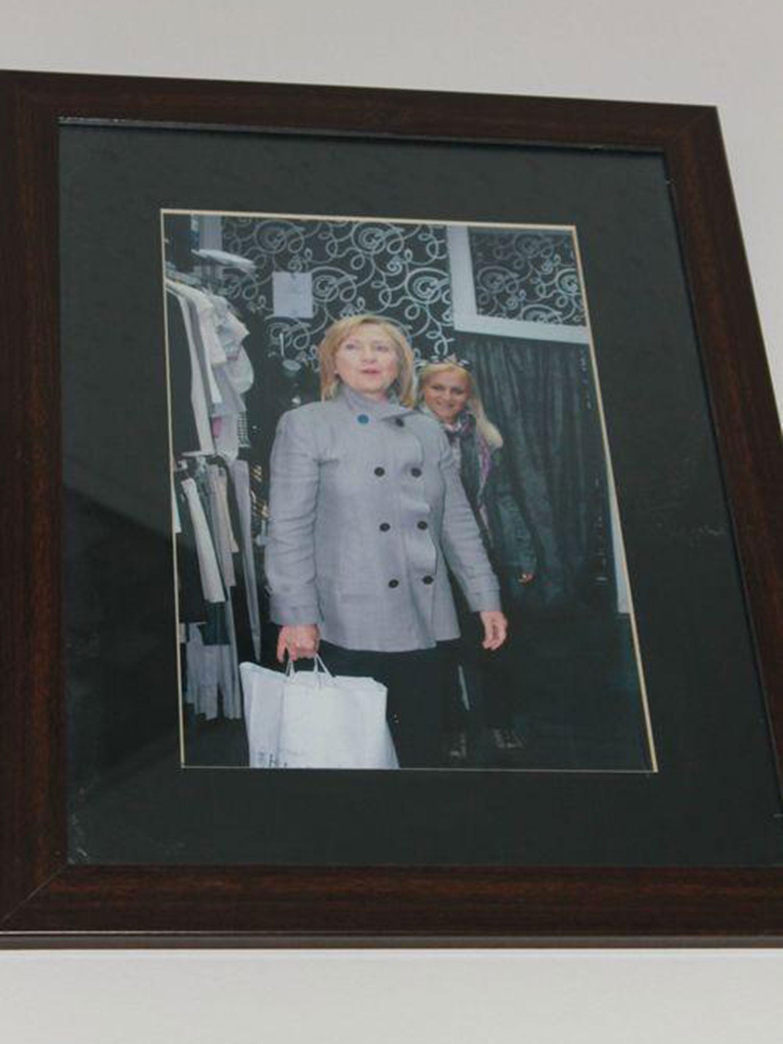 One of the photos of Mrs. Clinton hanging above the dressing rooms